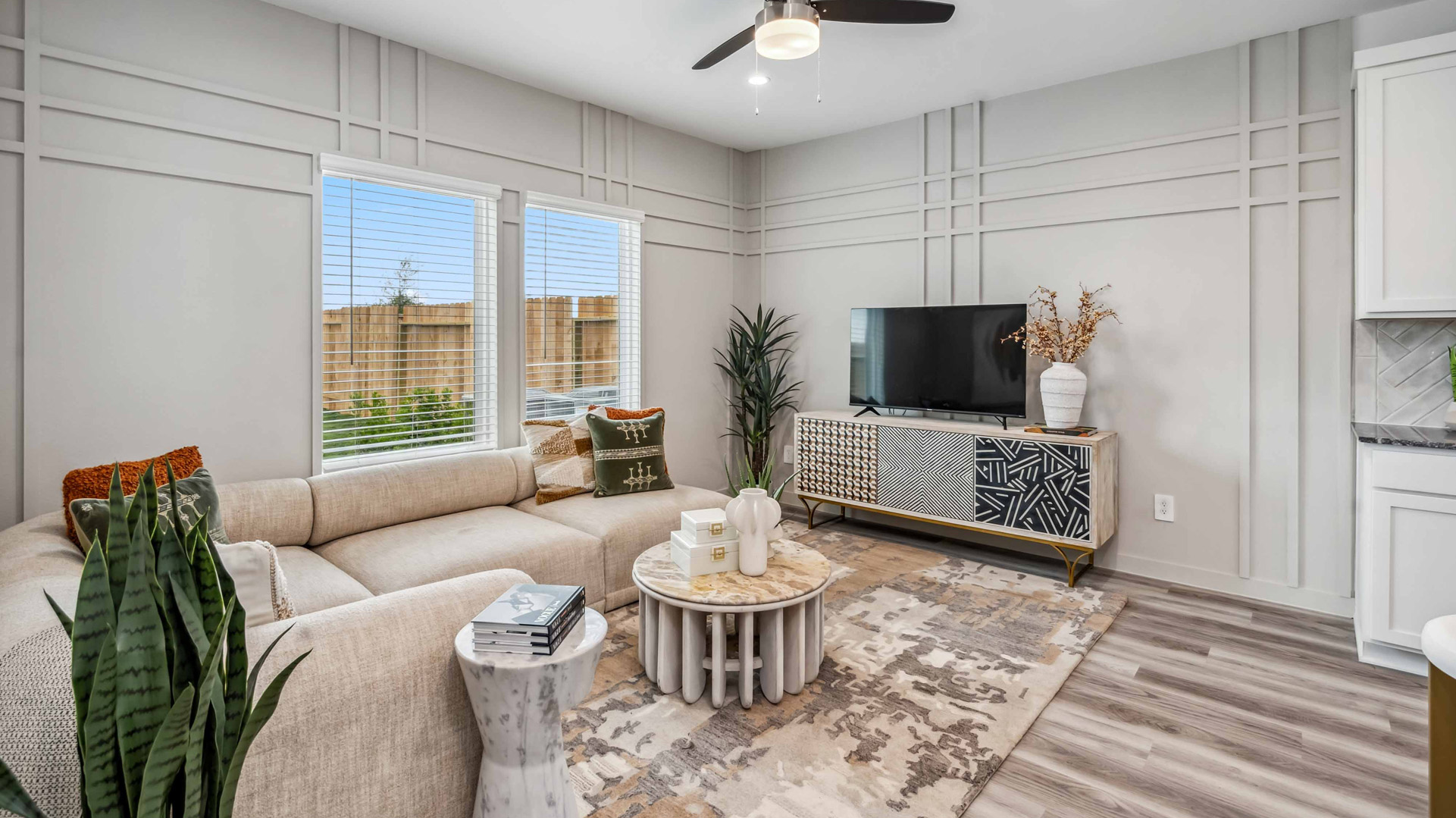 spacious living room overlooks the backyard