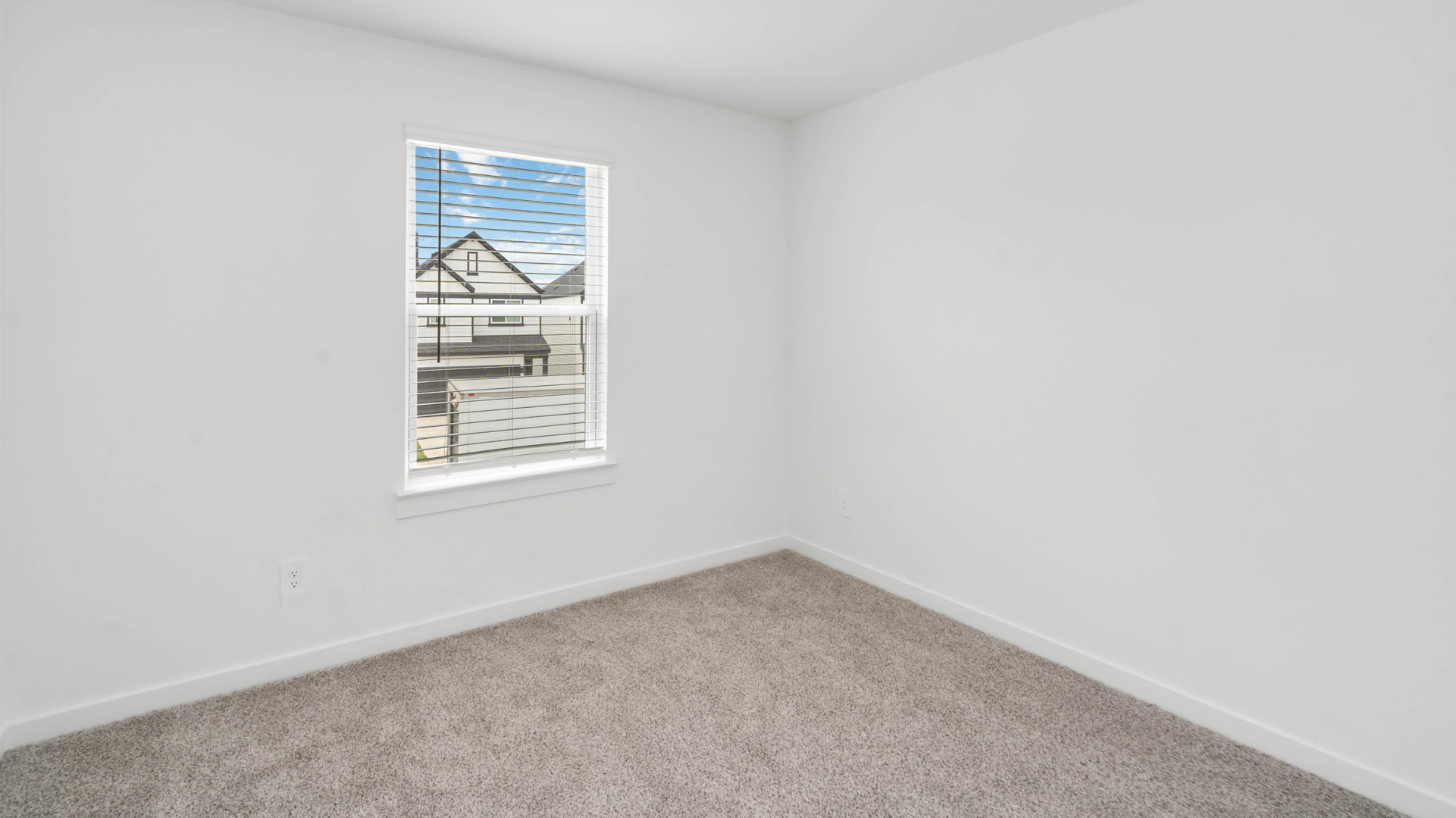 a third bedroom is also located upstairs with a tall single window