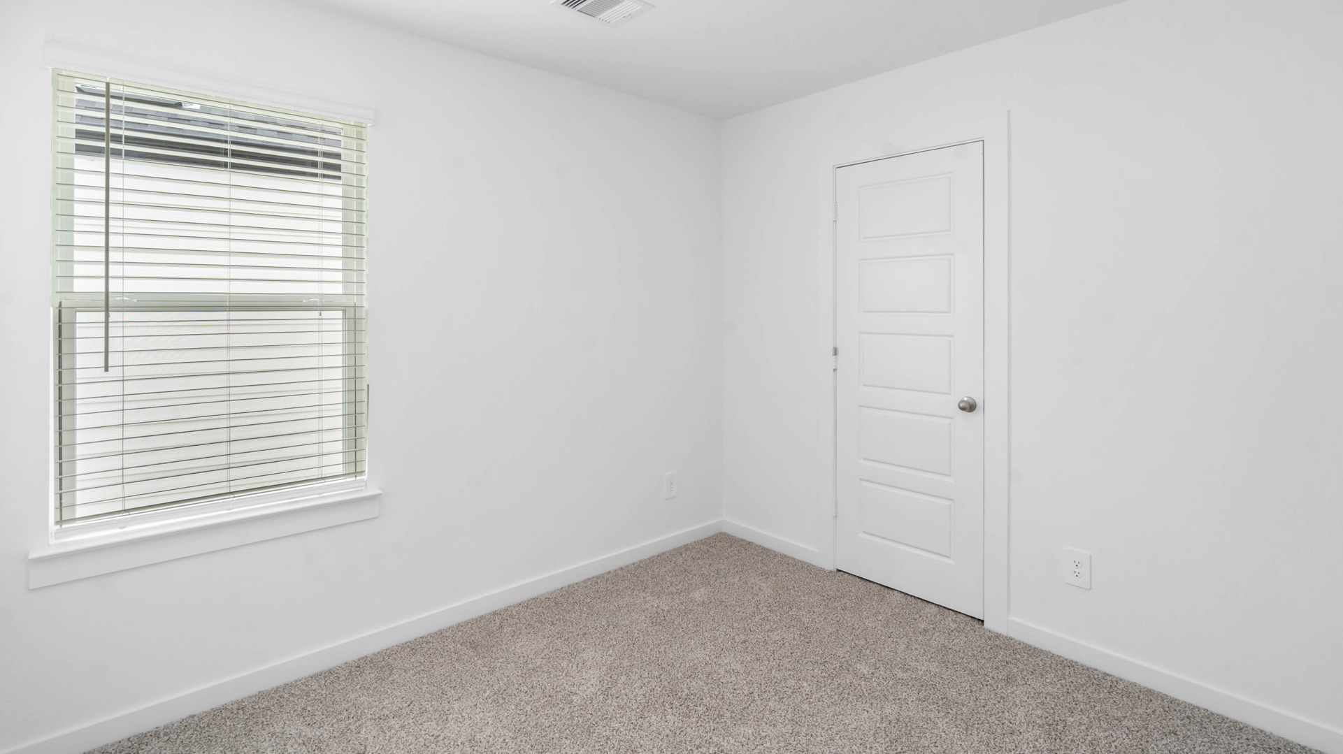 the fourth bedroom has a tall single window for natural light