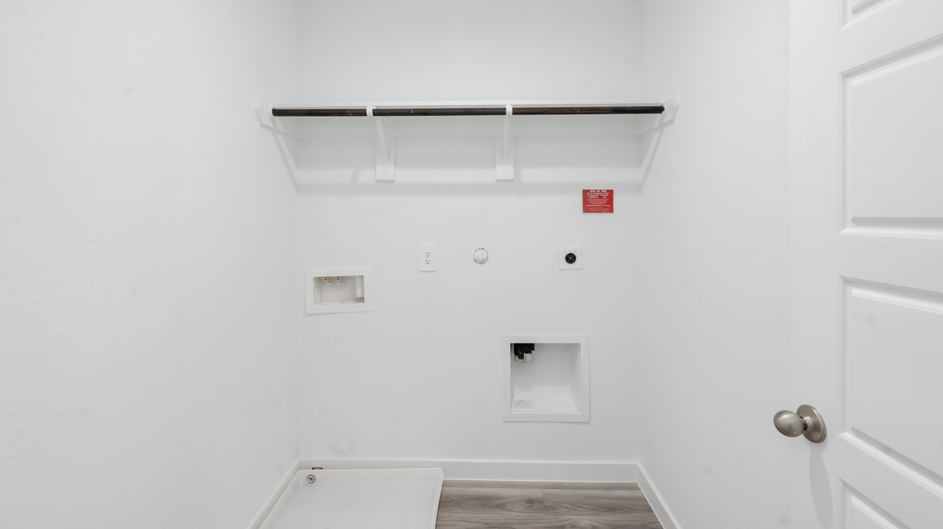 a laundry room is conveniently located upstairs between the bedrooms