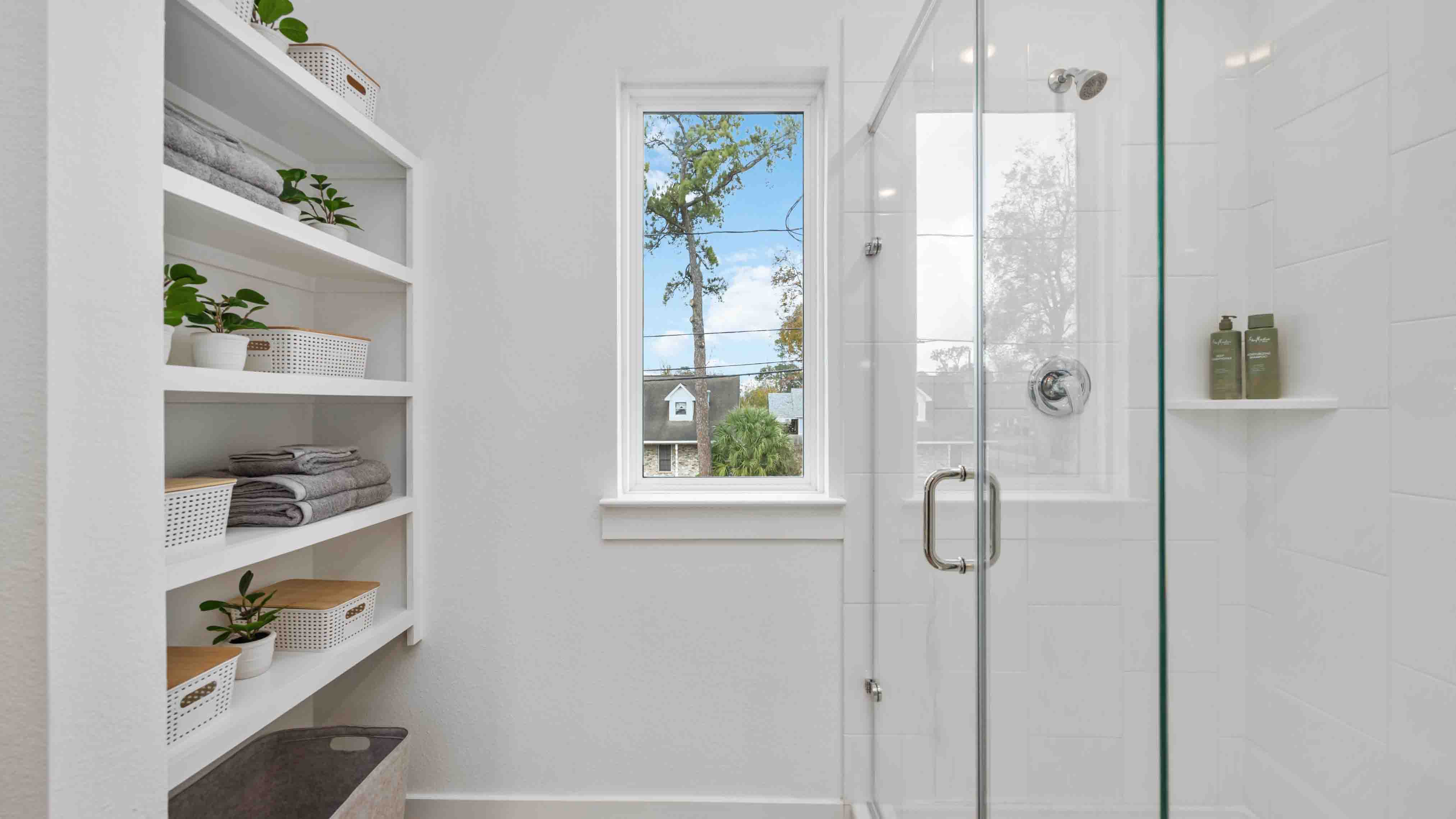 the en-suite primary bathroom has a double vanity and spacious walk-in closet
