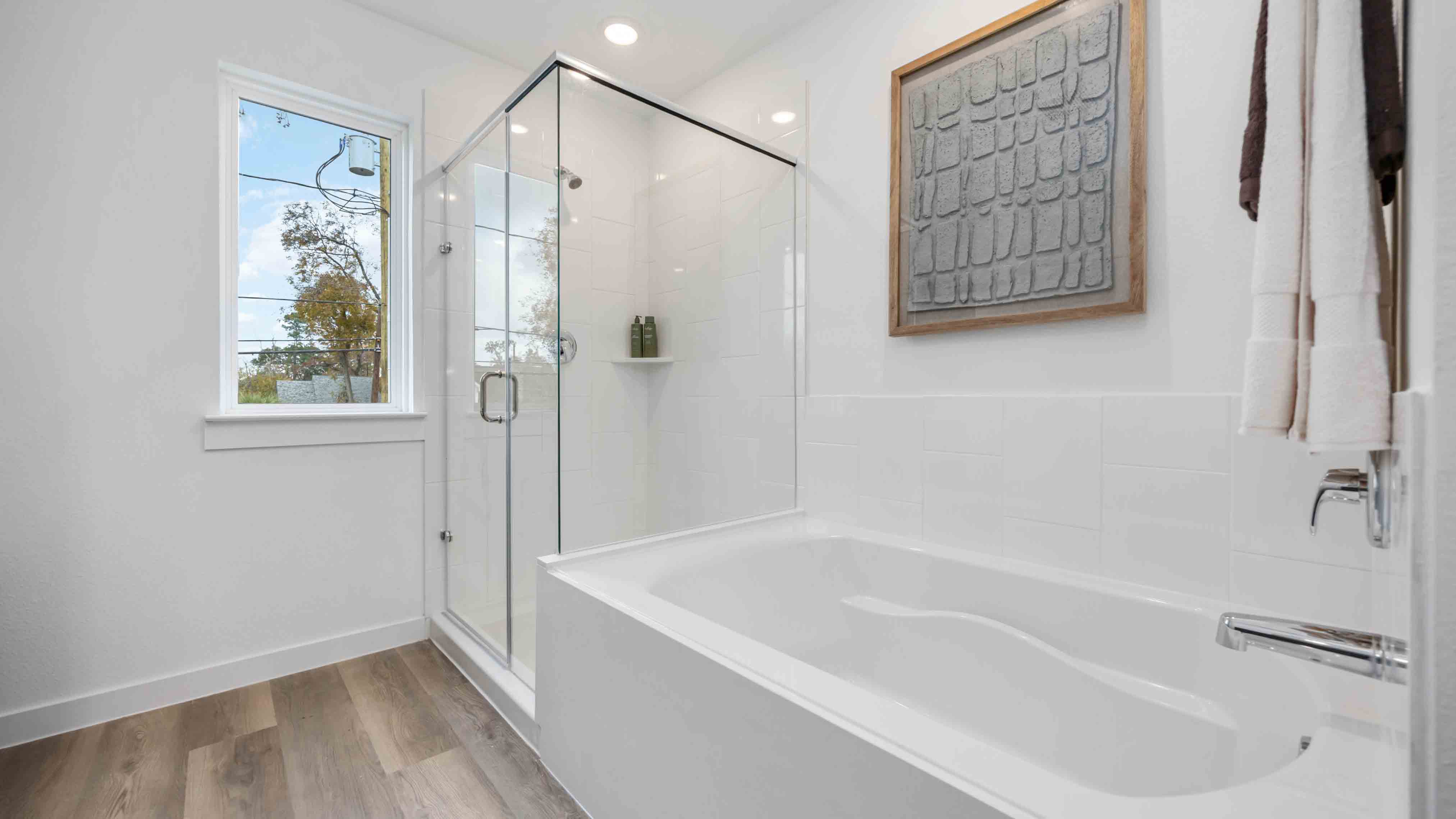 primary bathroom with a free standing tub