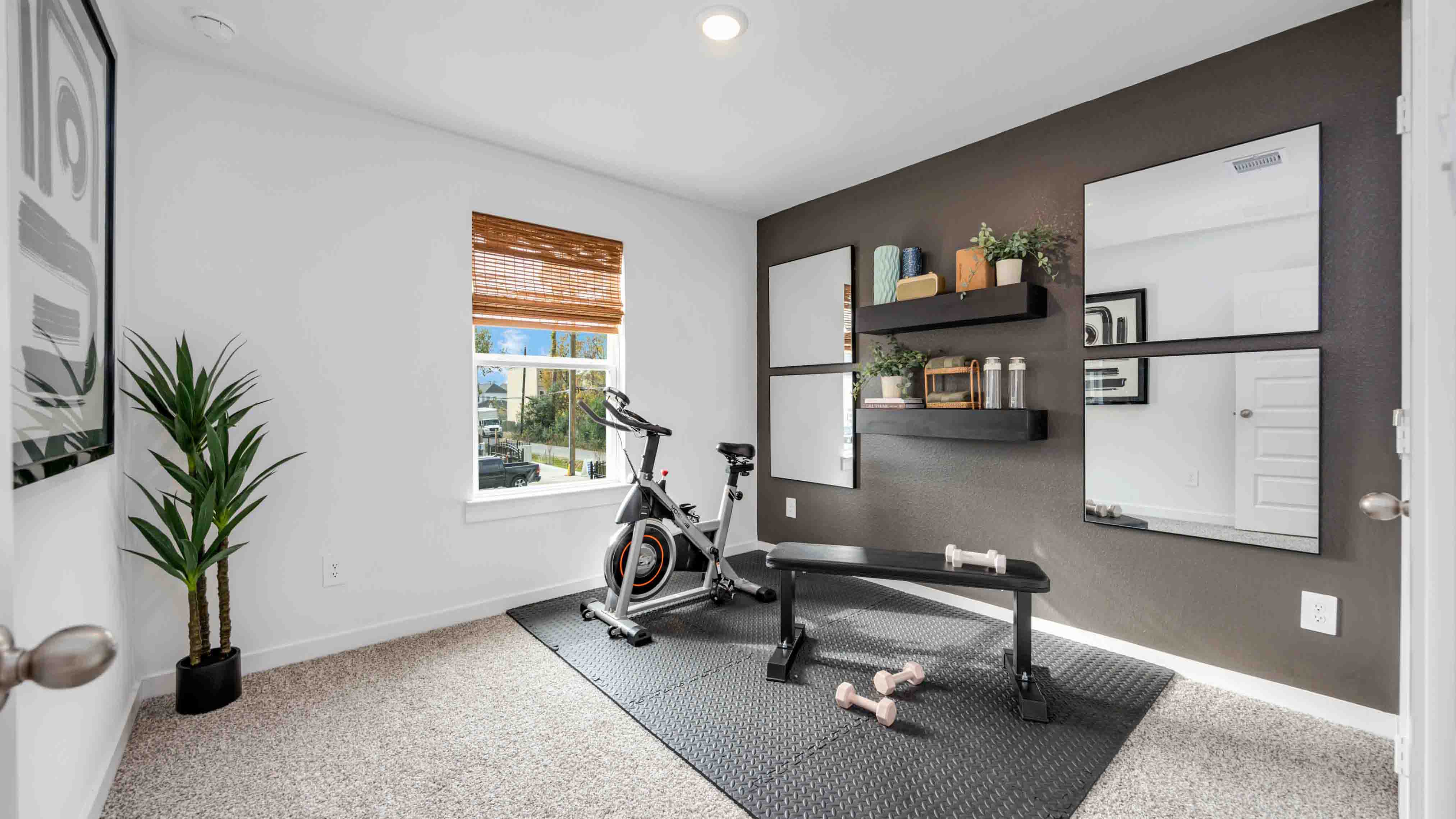 home office/third bedroom has light neutral walls and carpet flooring