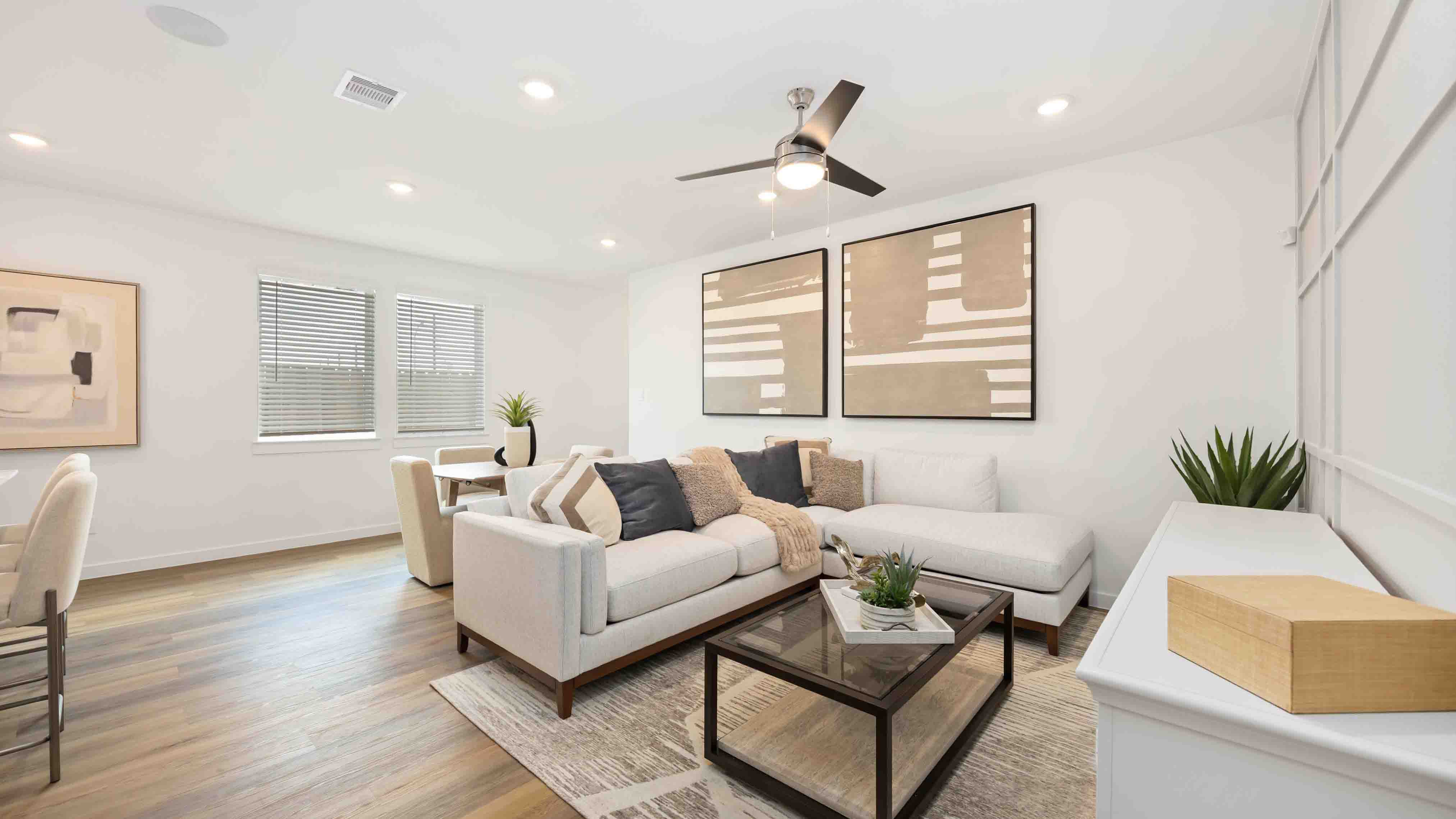 living room area with two large windows to the backyard