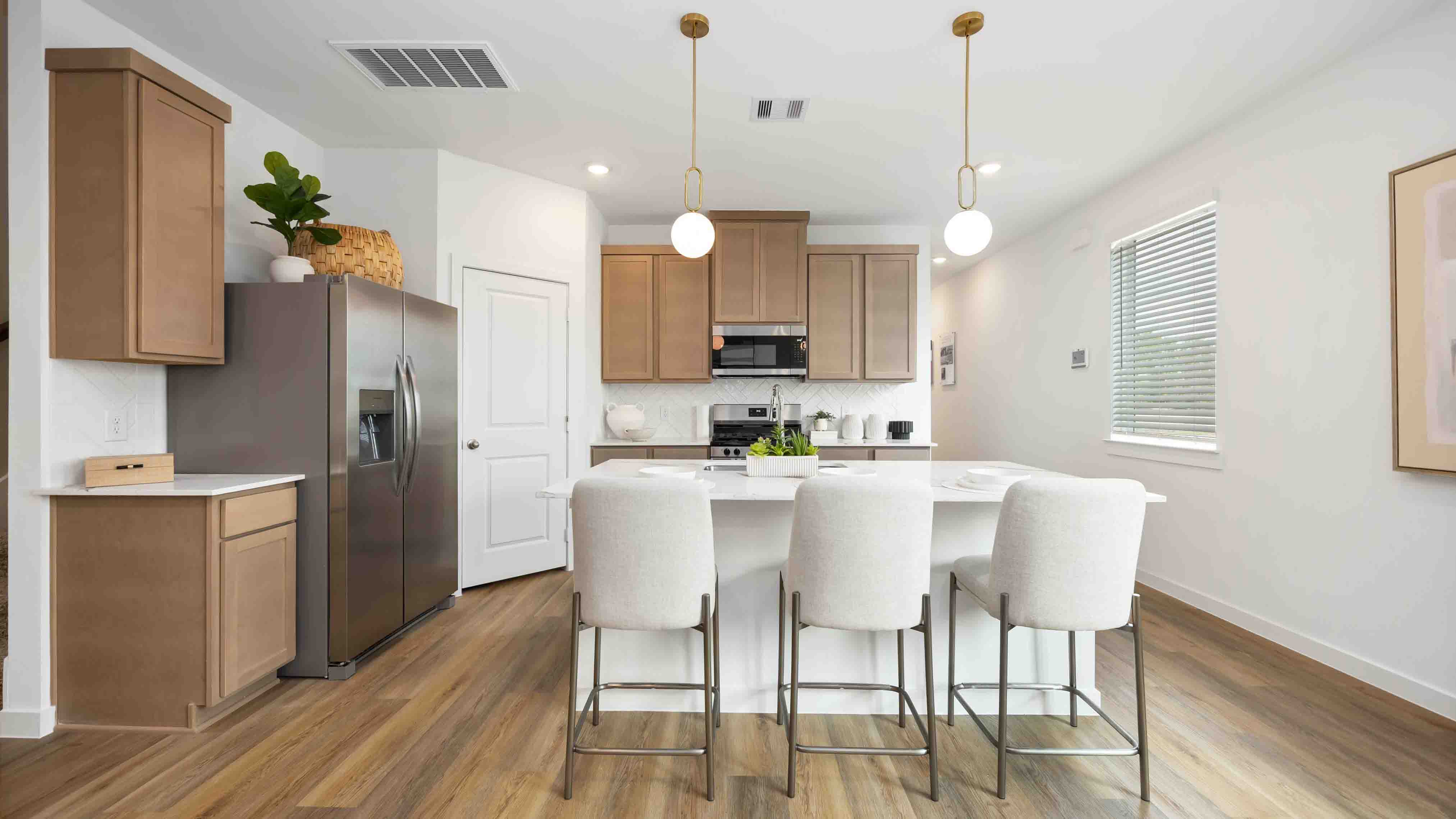 kitchen island - a spacious island offers bar seating perfect for dining or entertaining