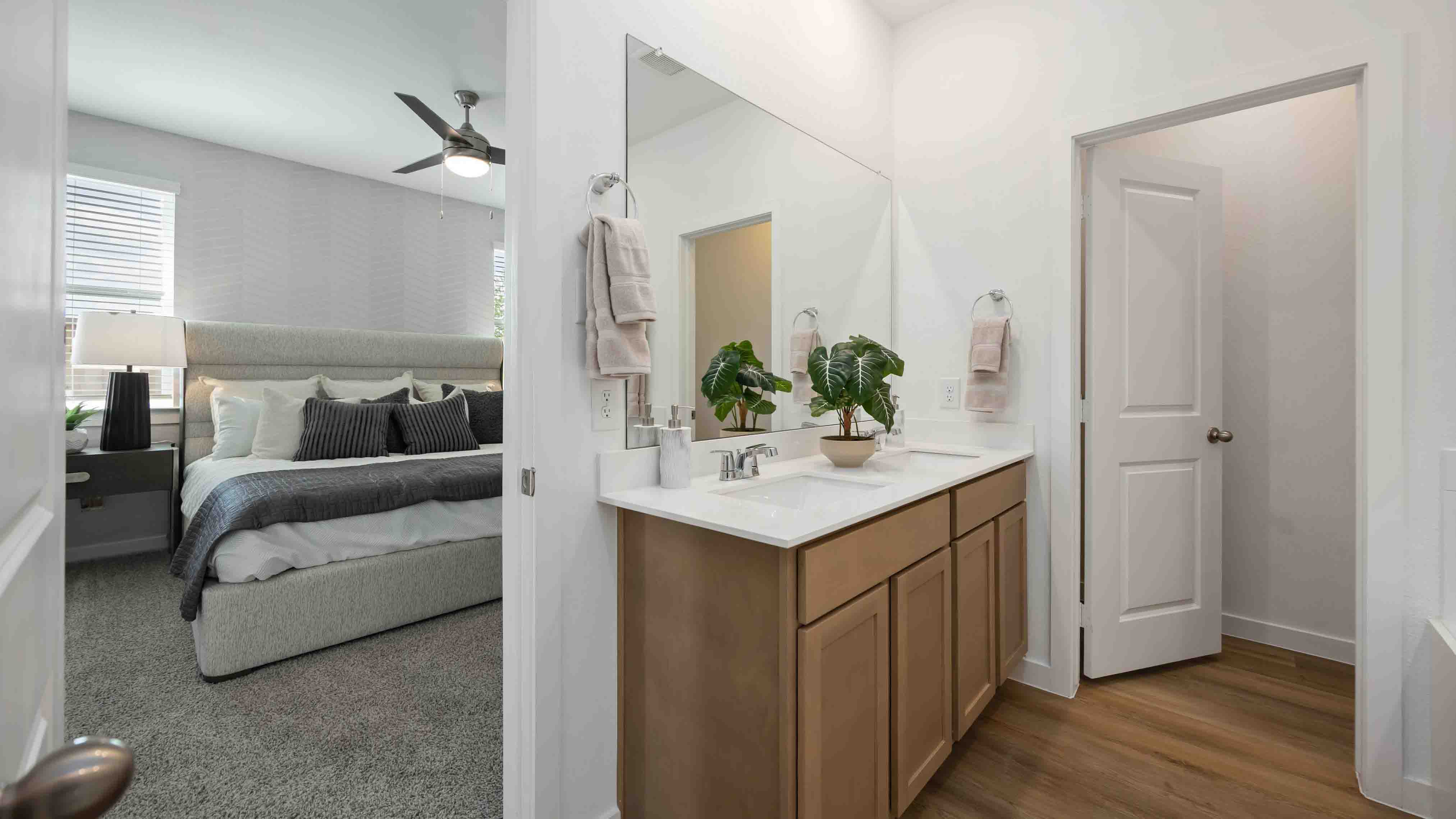 the en-suite primary bathroom has a single vanity and a standing shower