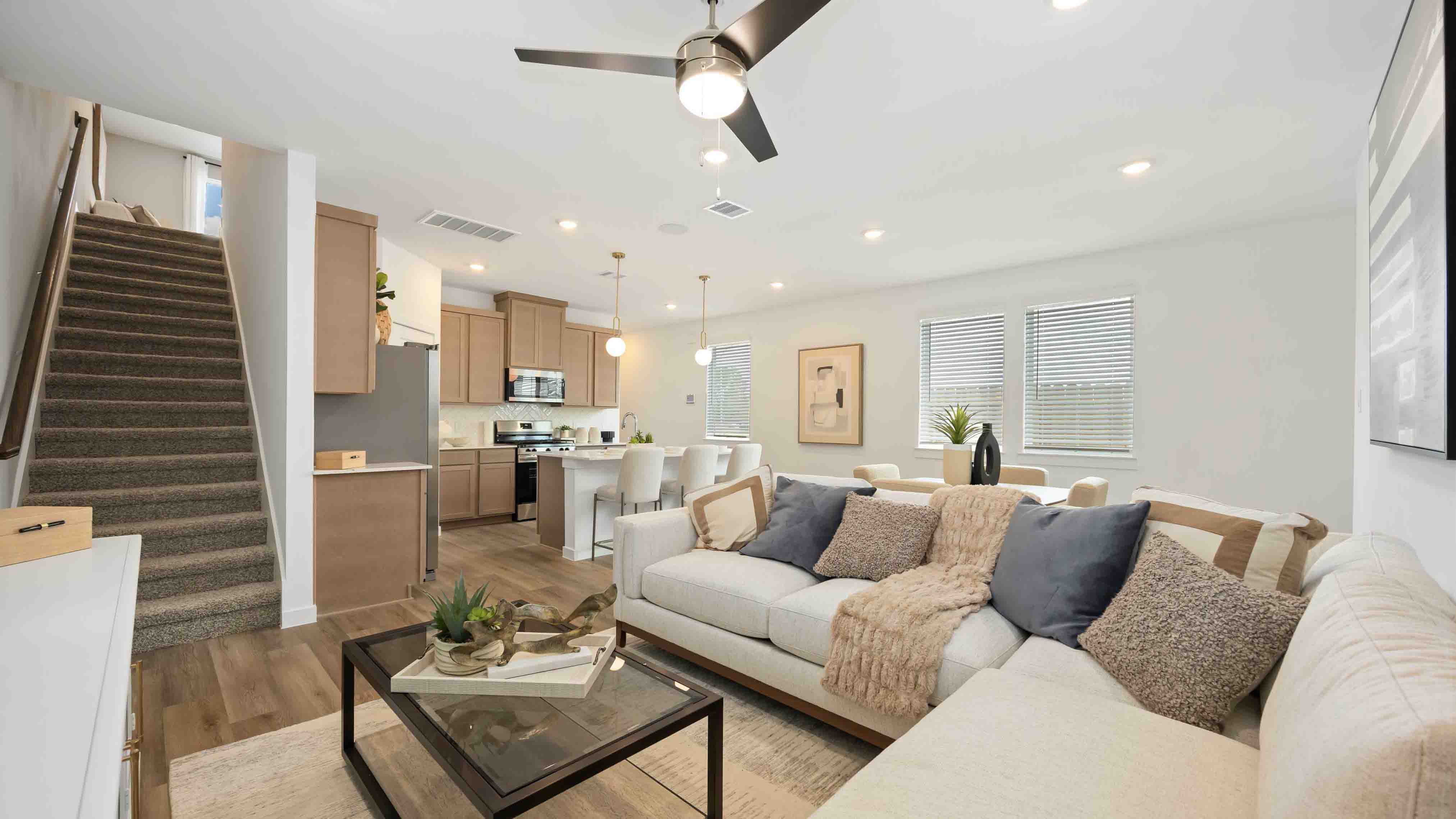 spacious living room with plenty of natural light from windows overlooking the side yard
