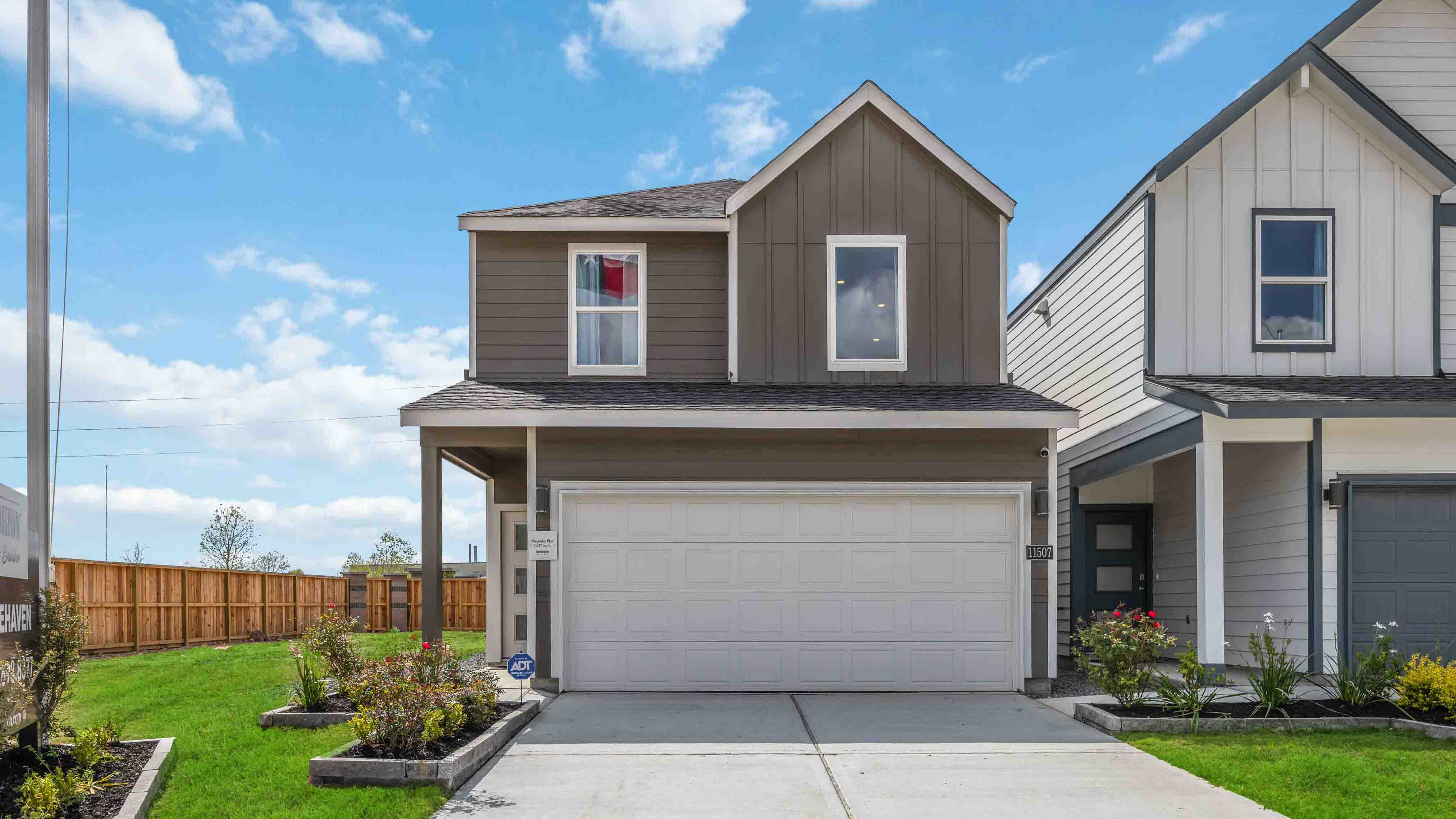 two-story home with siding and a two-car garage