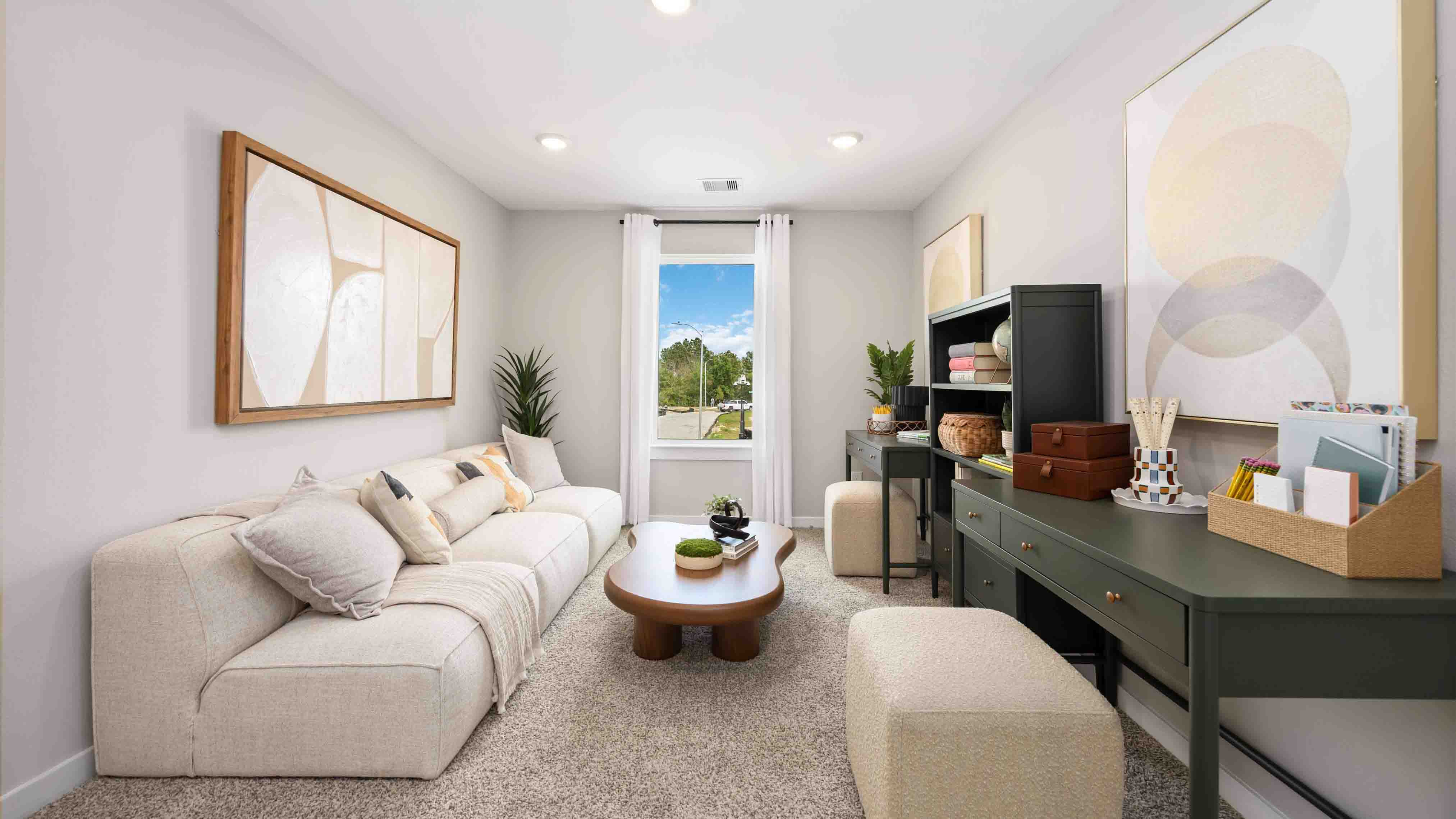 spacious upstairs living area with plenty of natural light from windows overlooking side of the home