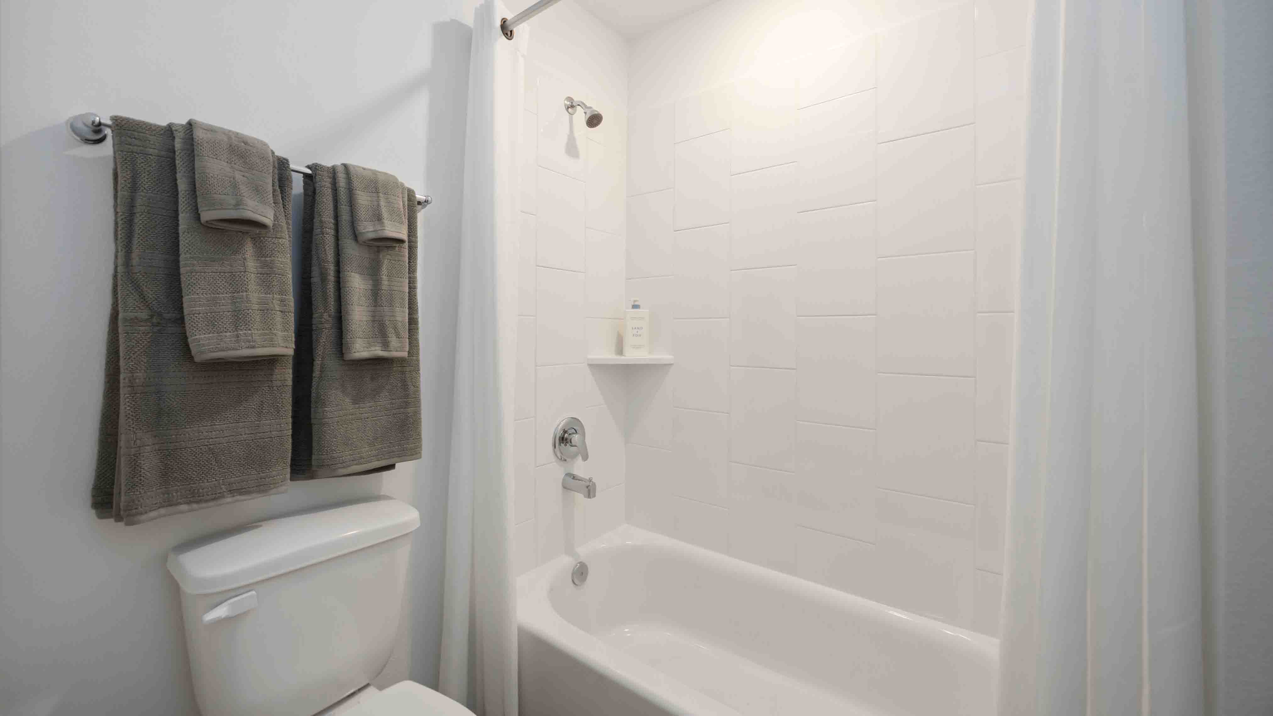 secondary bathroom with a standing tub