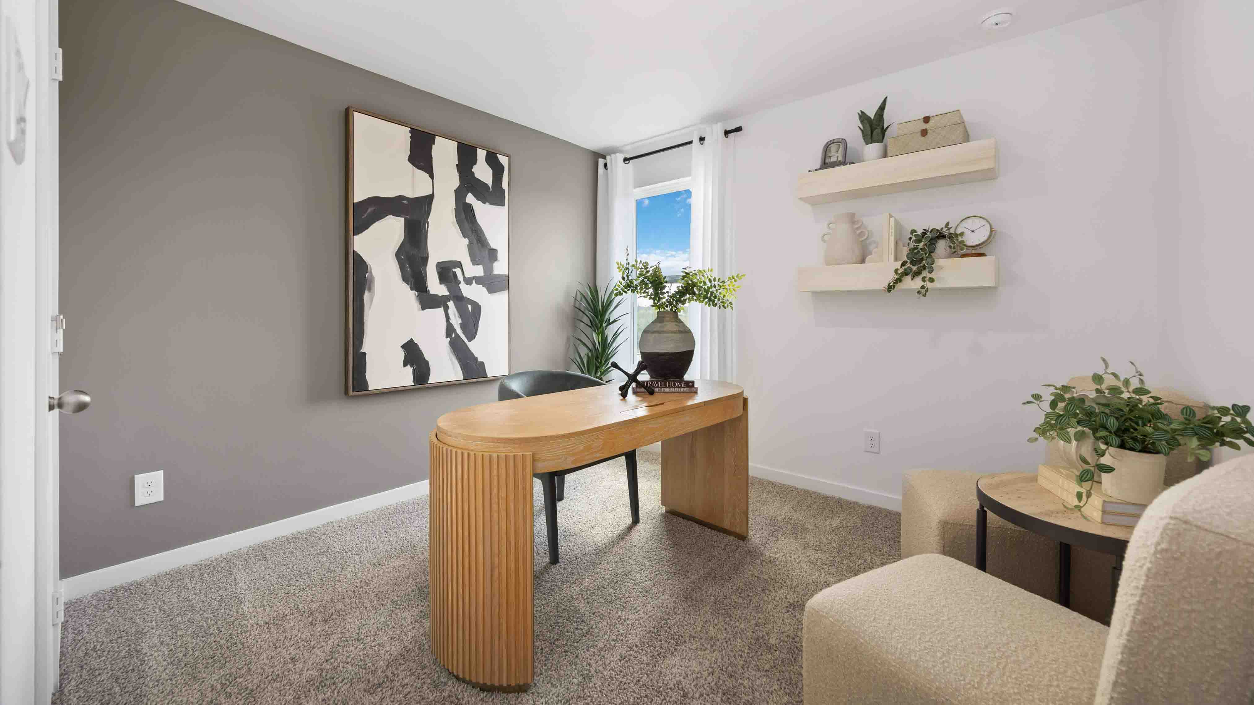 a third bedroom, shown as a home office, is also located upstairs