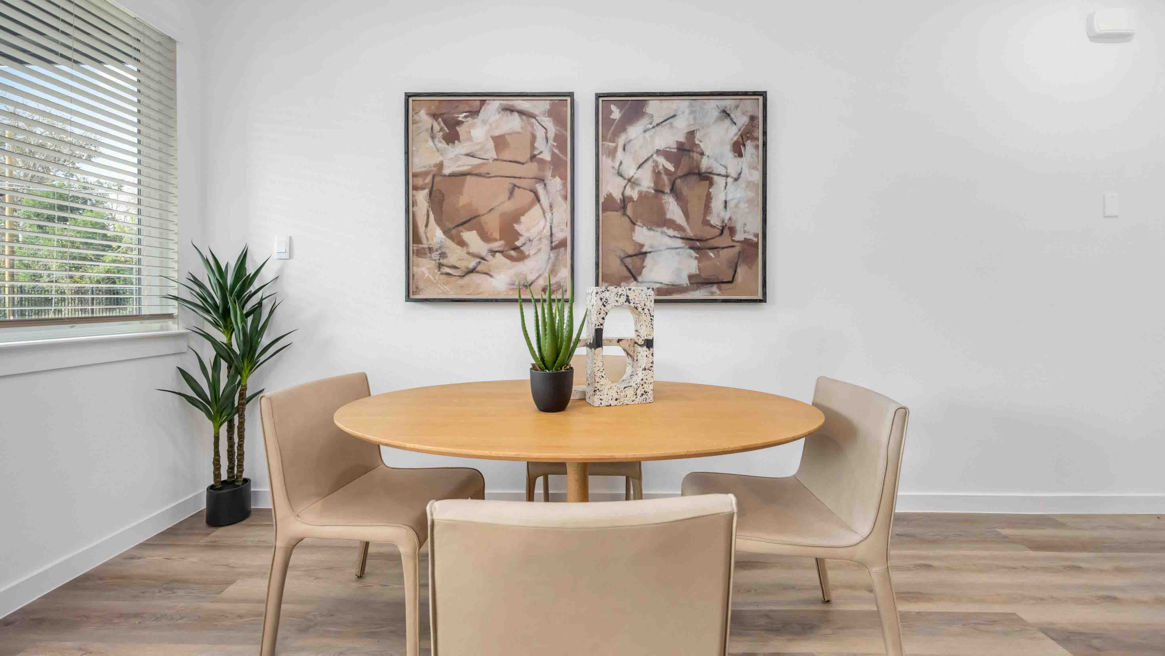 dining area with natural lighting that overlooks the backyard