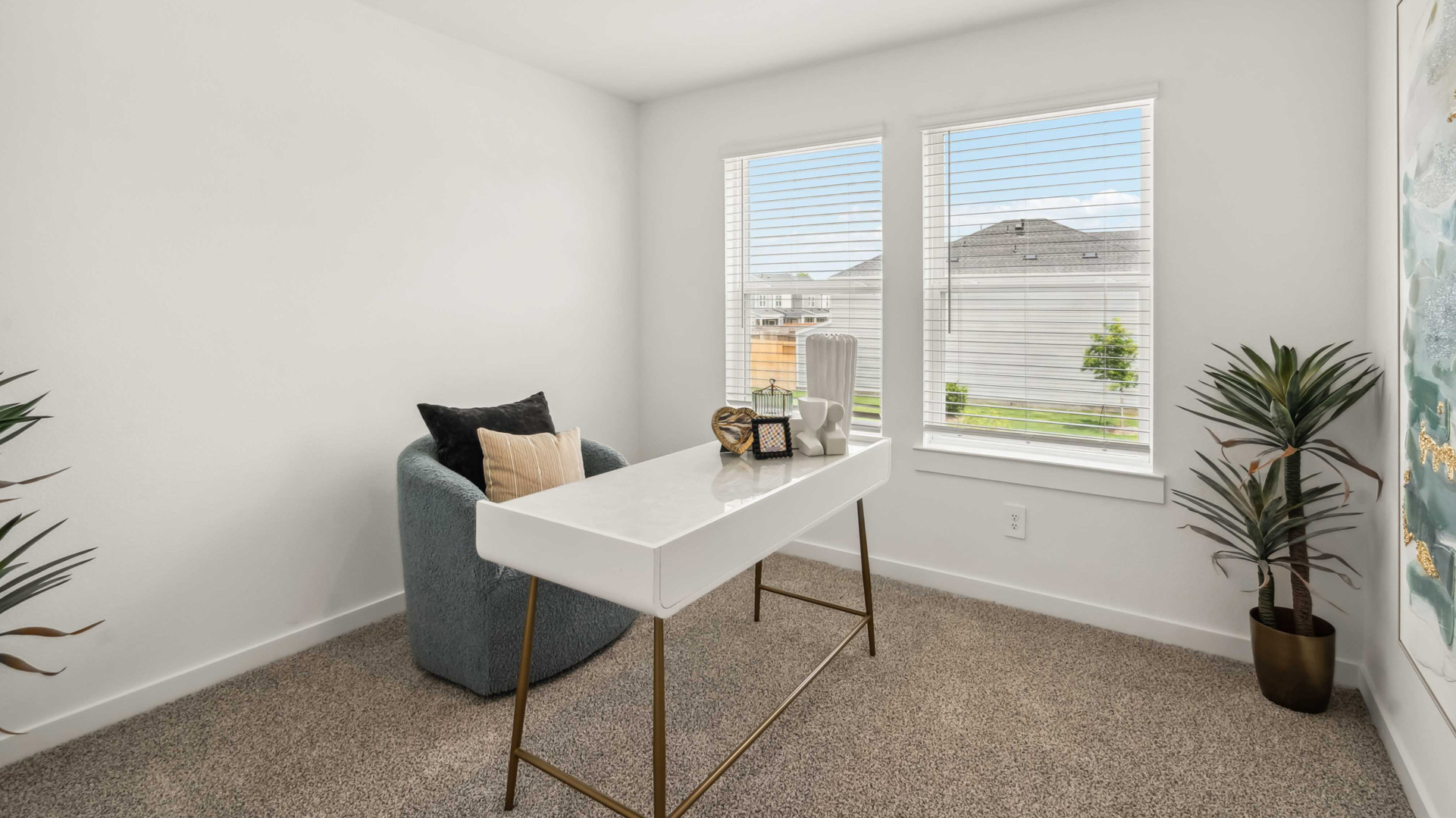 home office/third bedroom has light neutral walls and carpet flooring