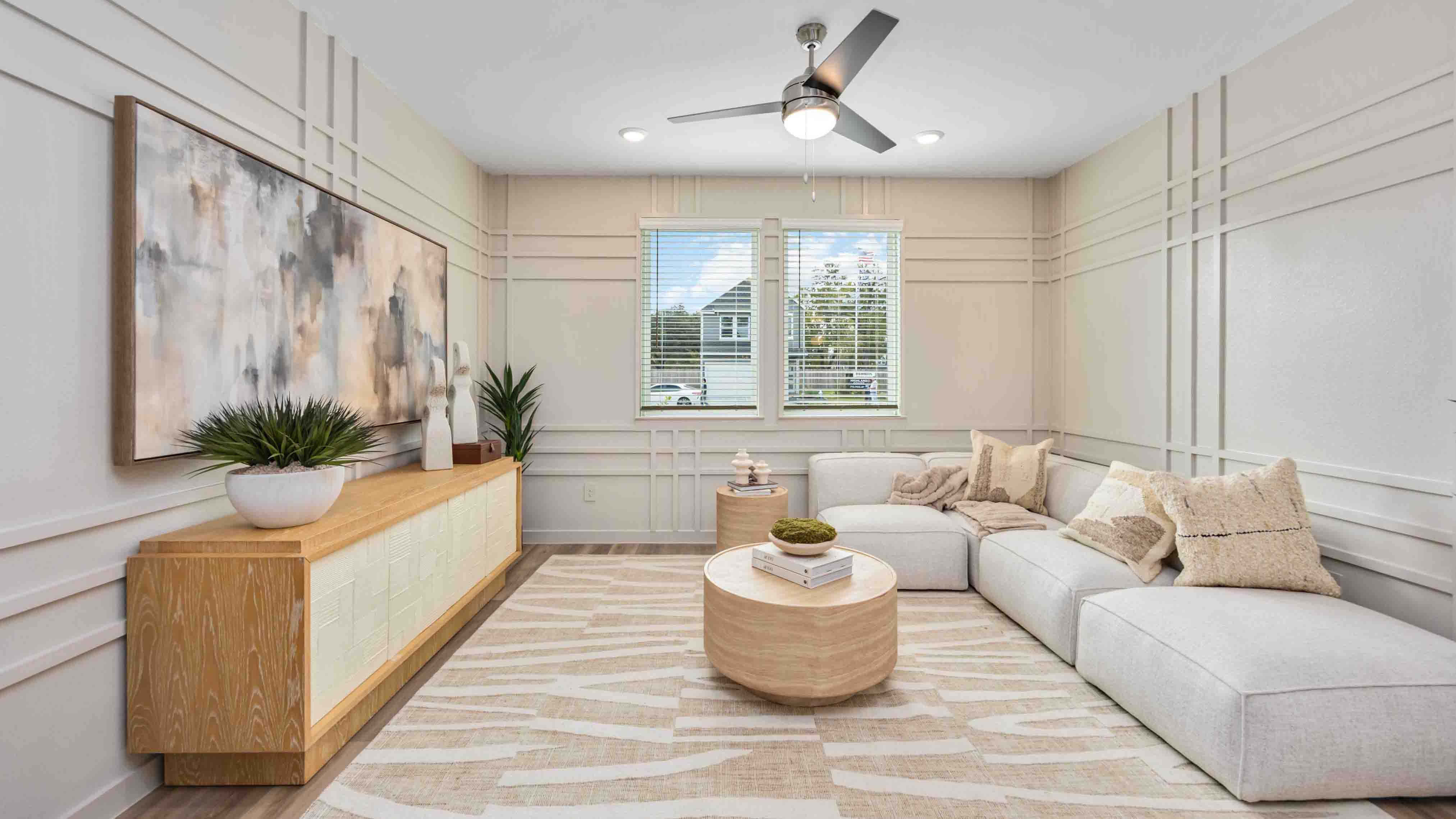 living room area with two large windows to the backyard