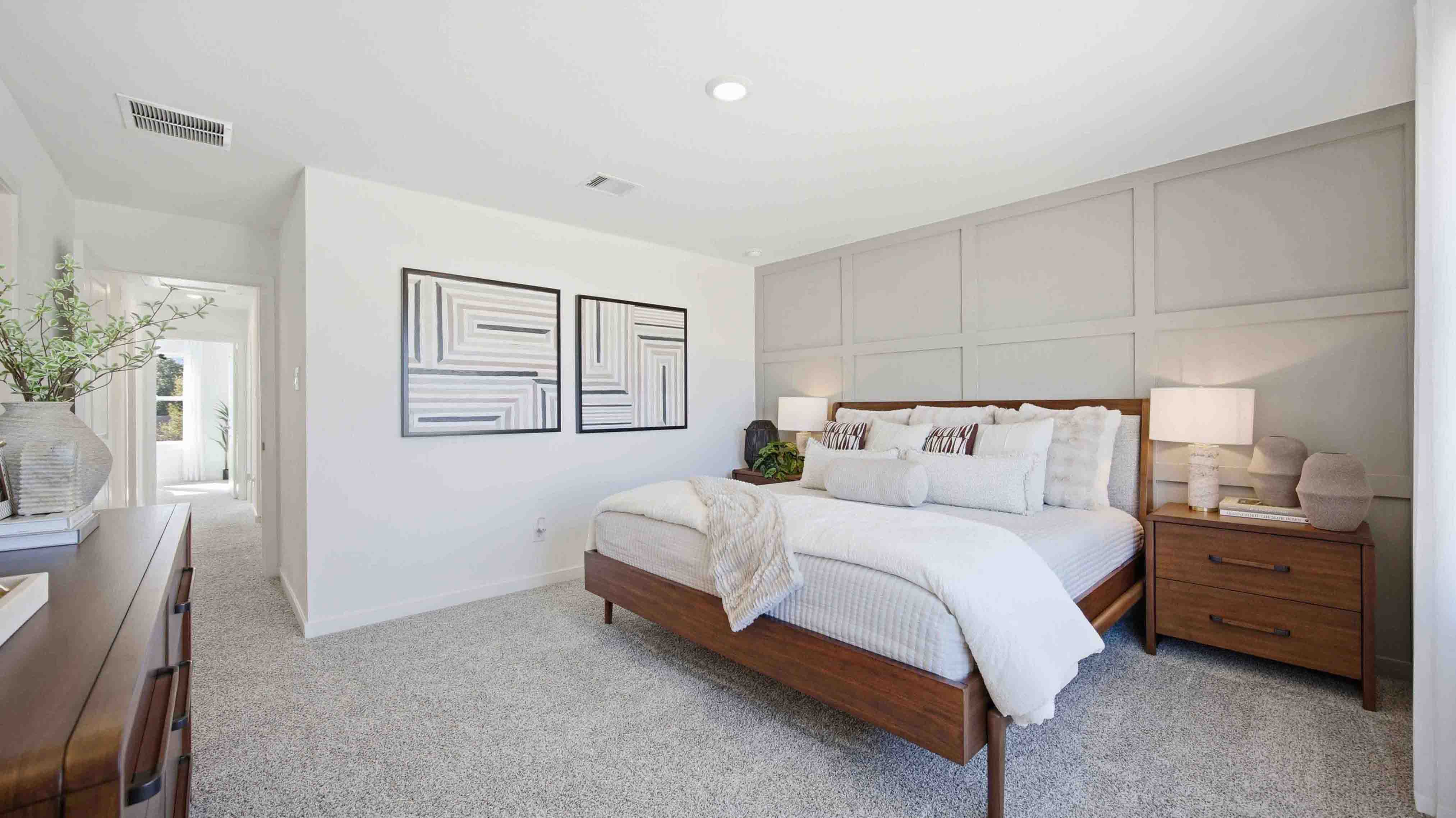 the en-suite primary bathroom has a double vanity, a standing shower and spacious walk-in closet