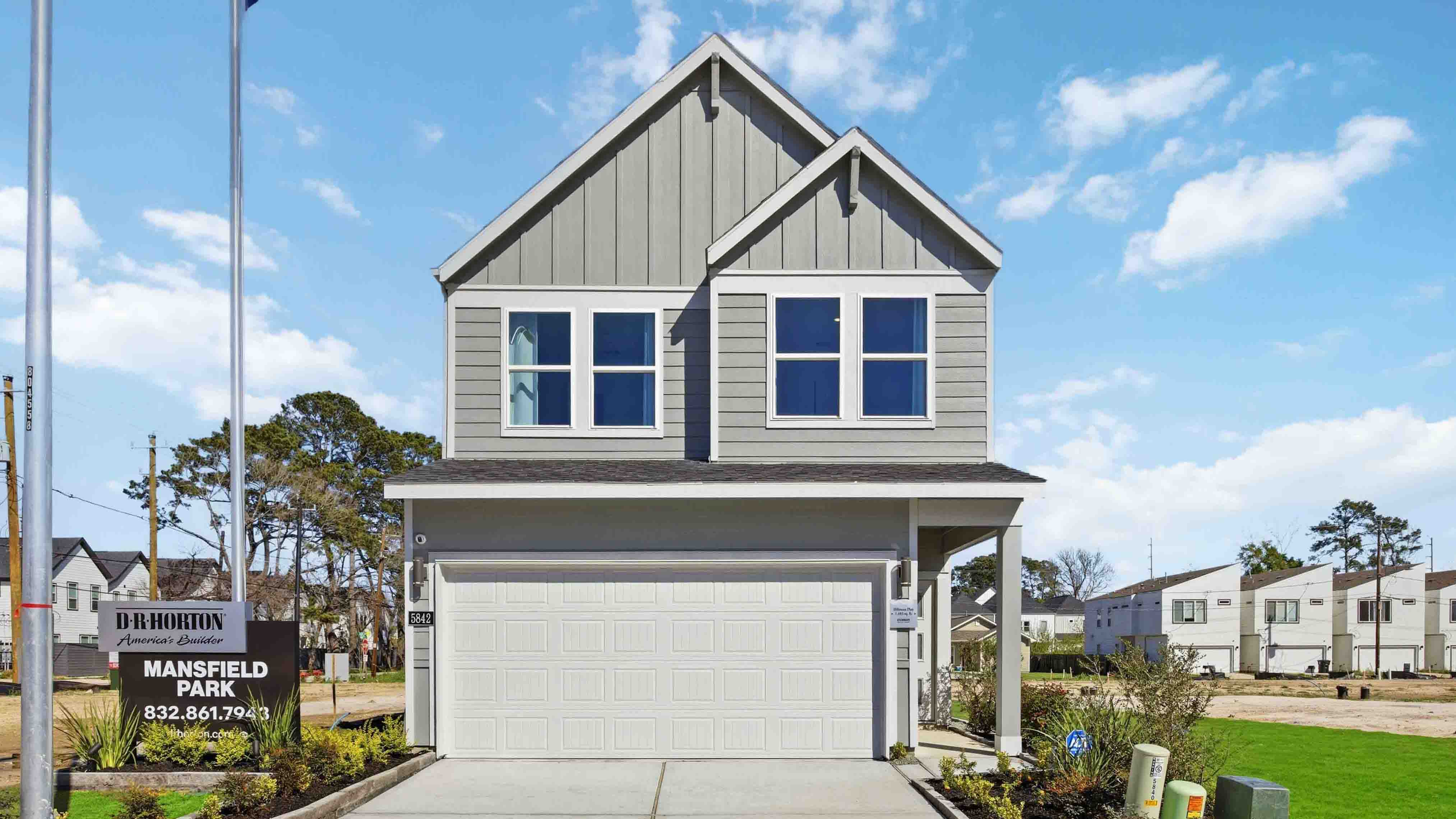 two-story home with siding and a two-car garage