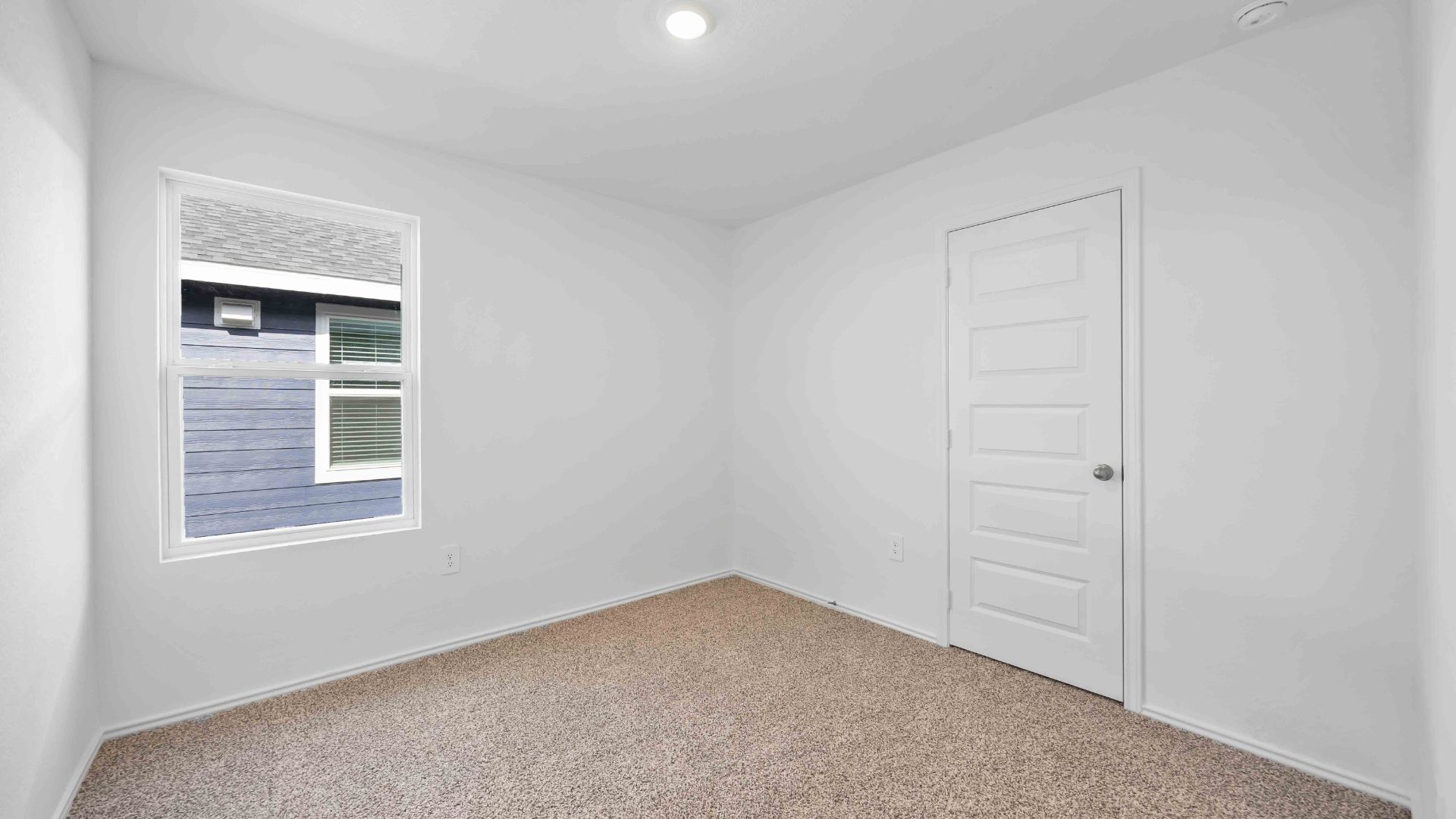 secondary bedroom with a window for natural light