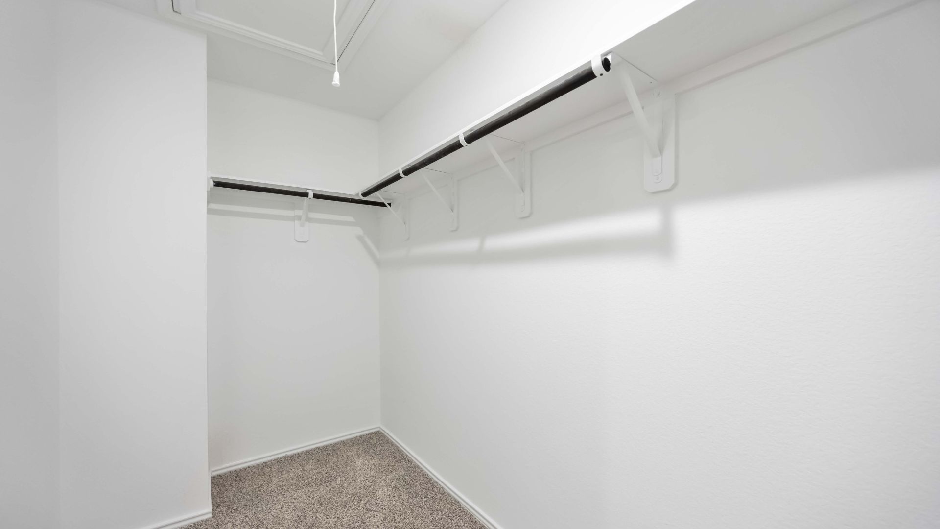 primary walk-in closet with lots of storage