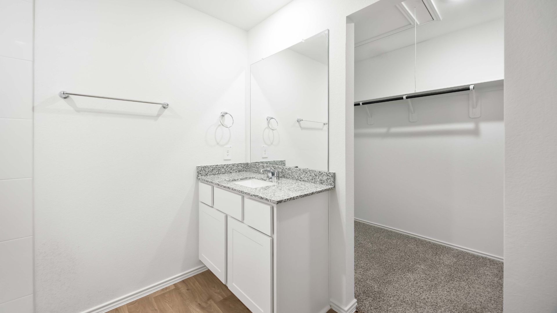 primary bathroom with a standing shower and one sink vanity