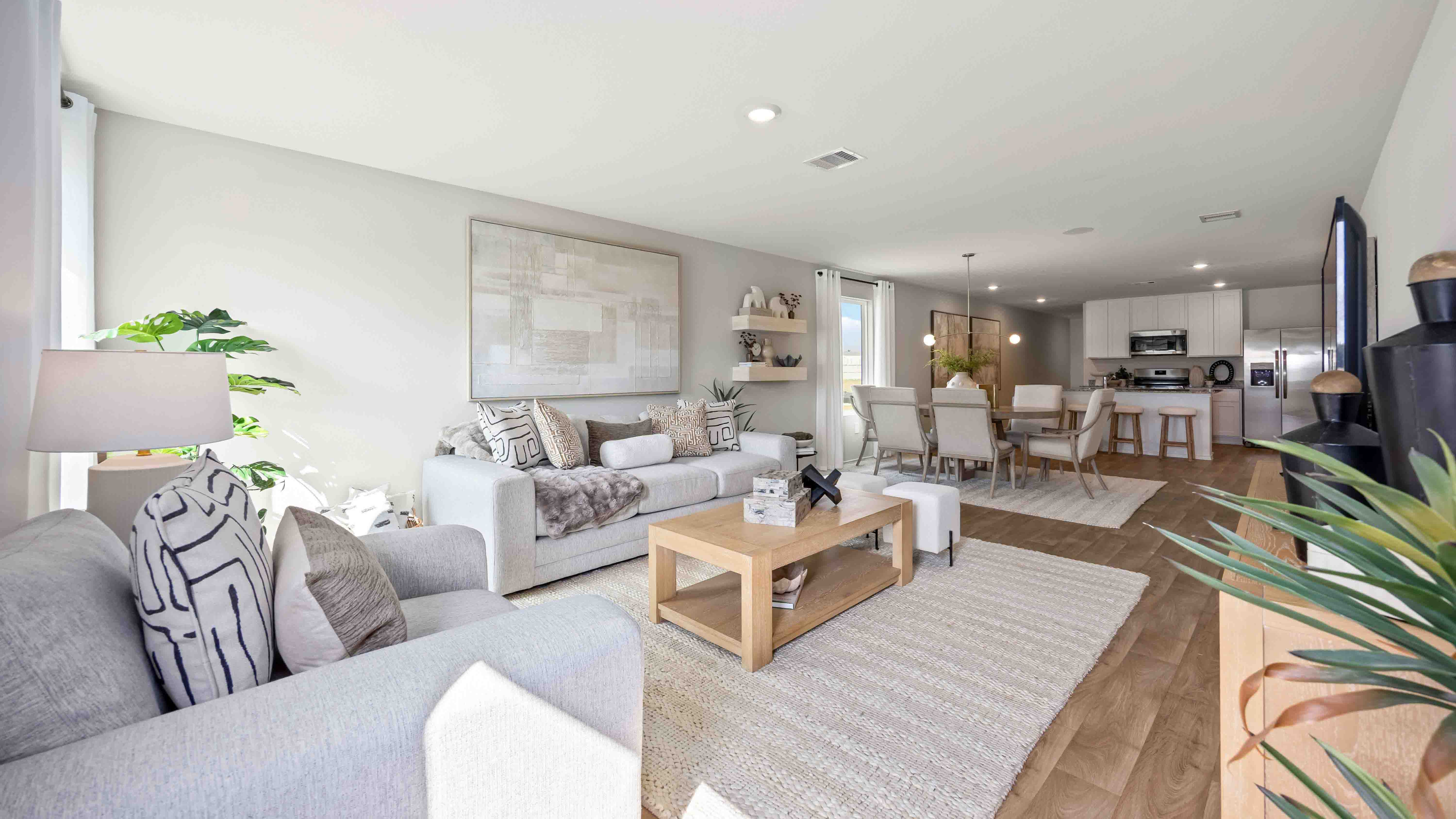 living room area with two large windows to the backyard