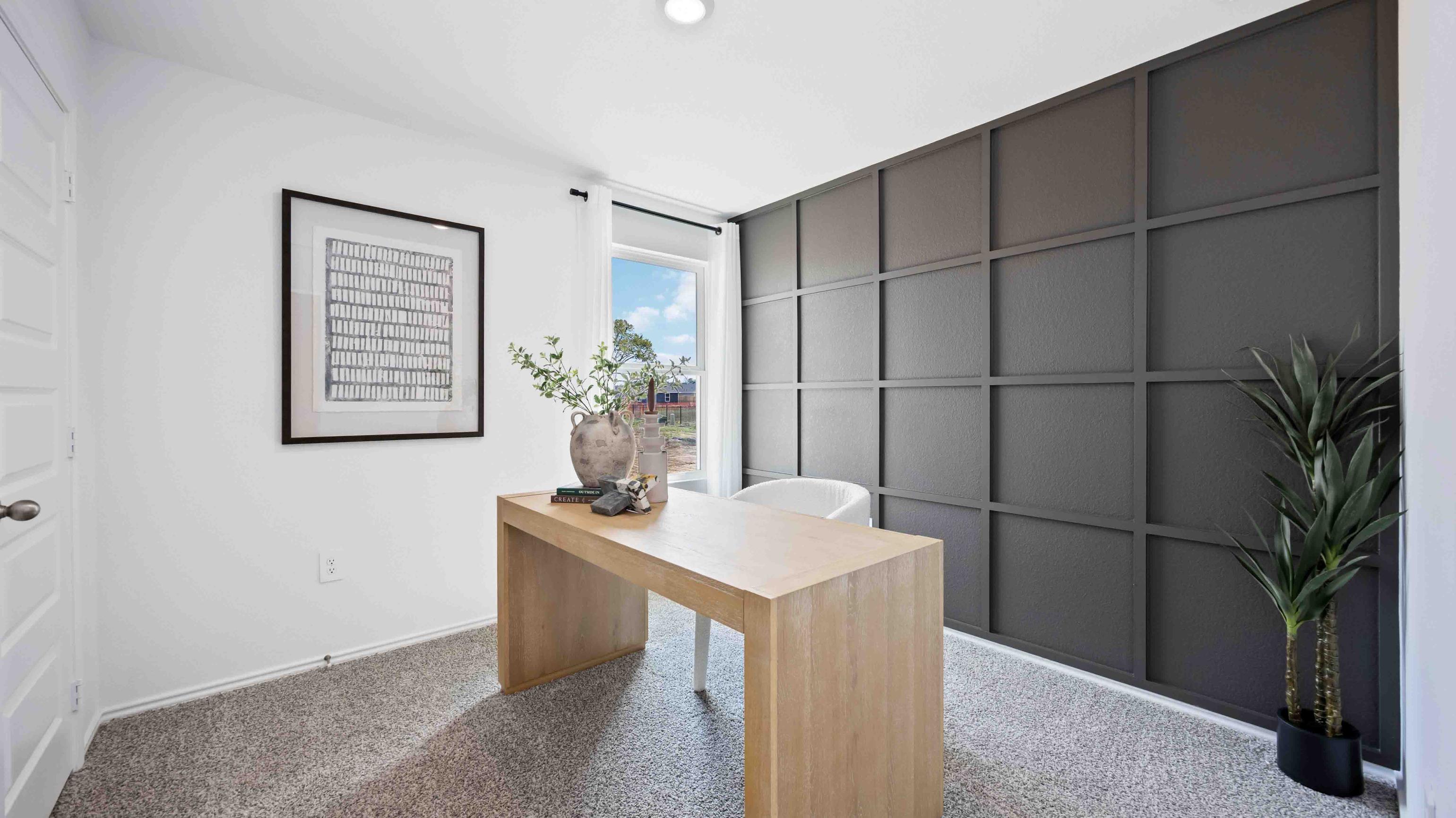 home office/third bedroom has light neutral walls and carpet flooring