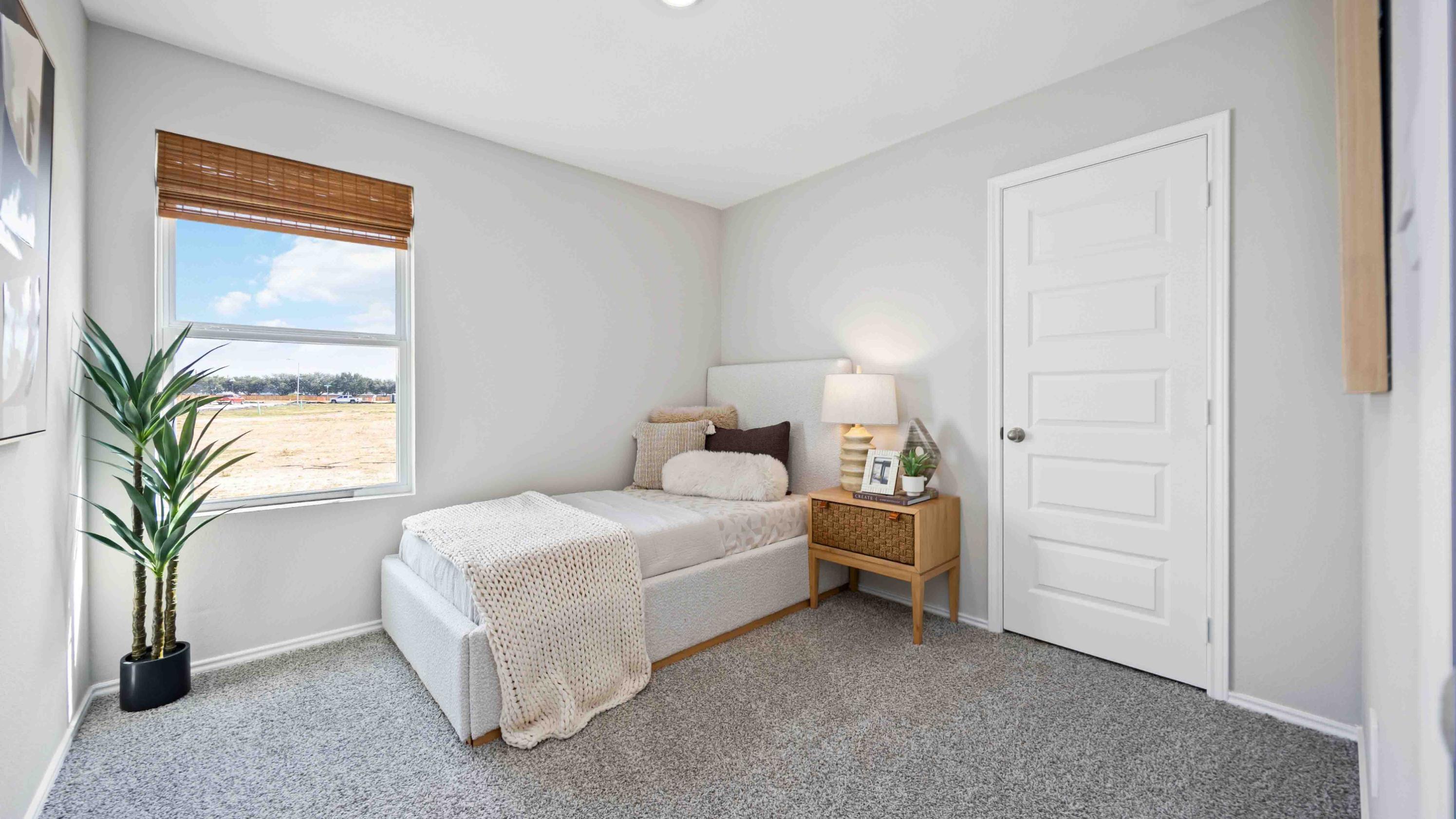 home office/third bedroom has light neutral walls and carpet flooring