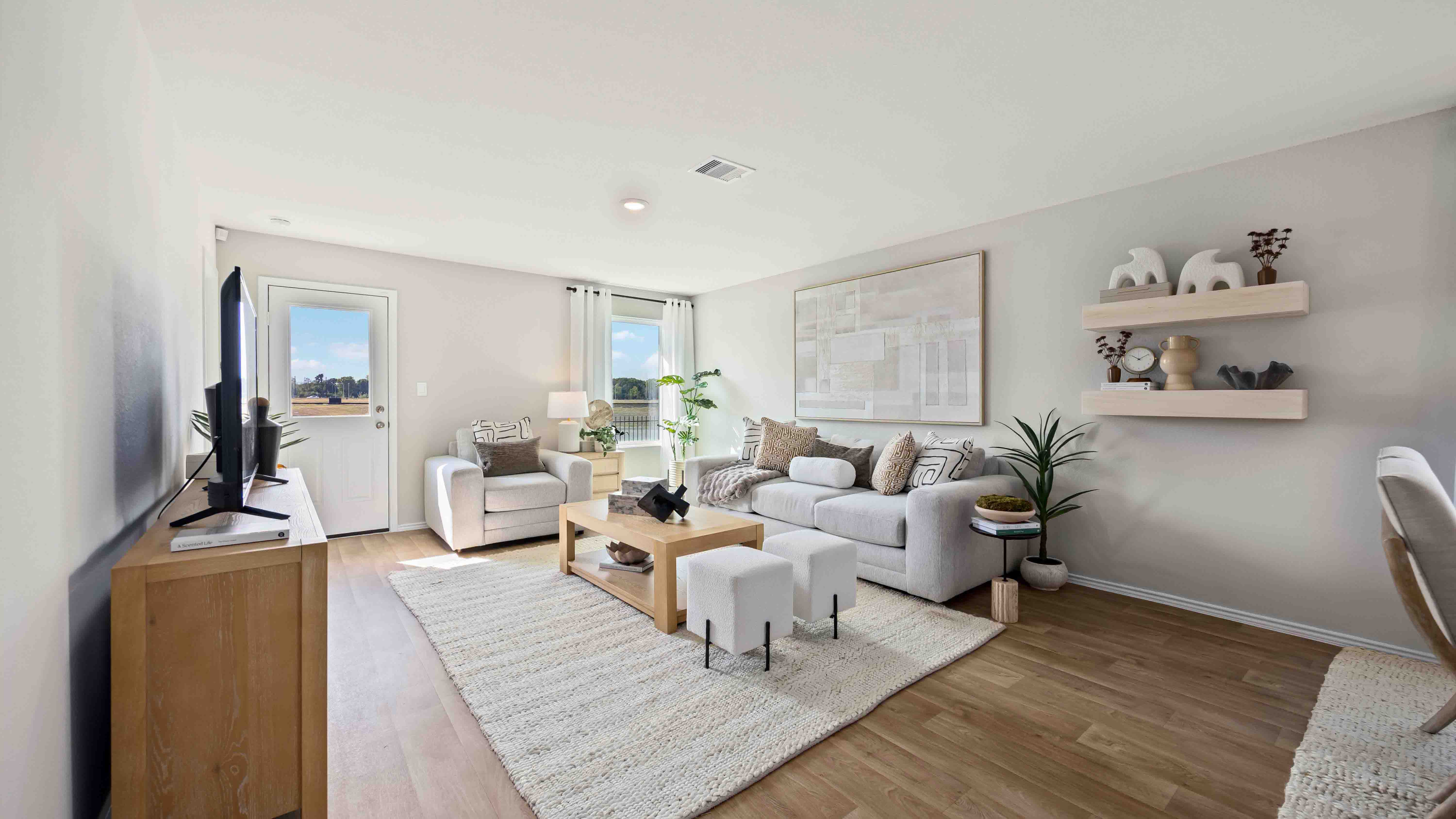 living room area with two large windows to the backyard