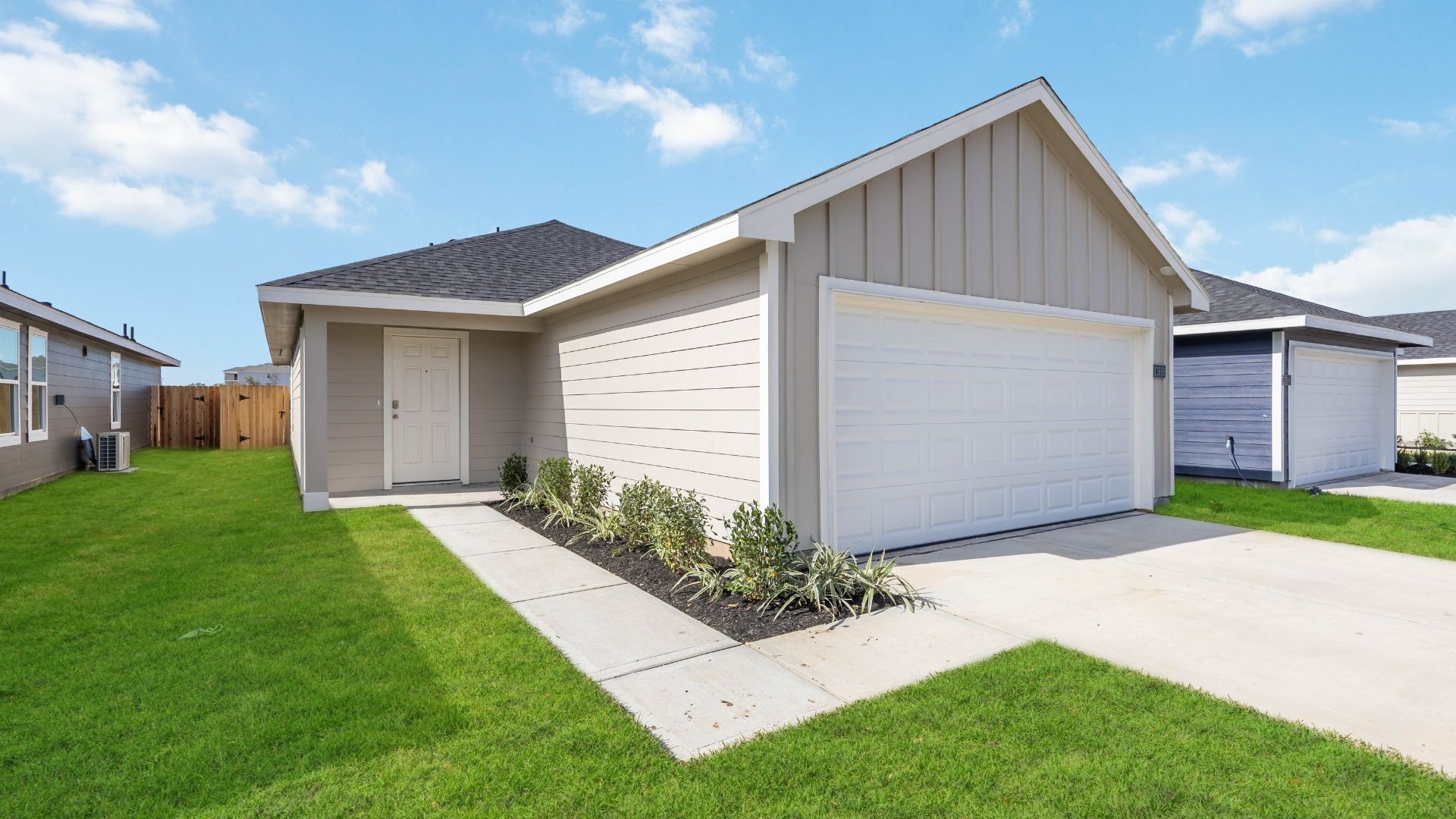 One-story home with siding and a two-car garage