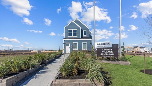 Two-story home with siding and a two-car garage.