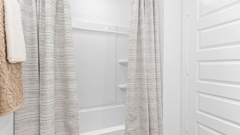 Secondary bathroom with standing tub