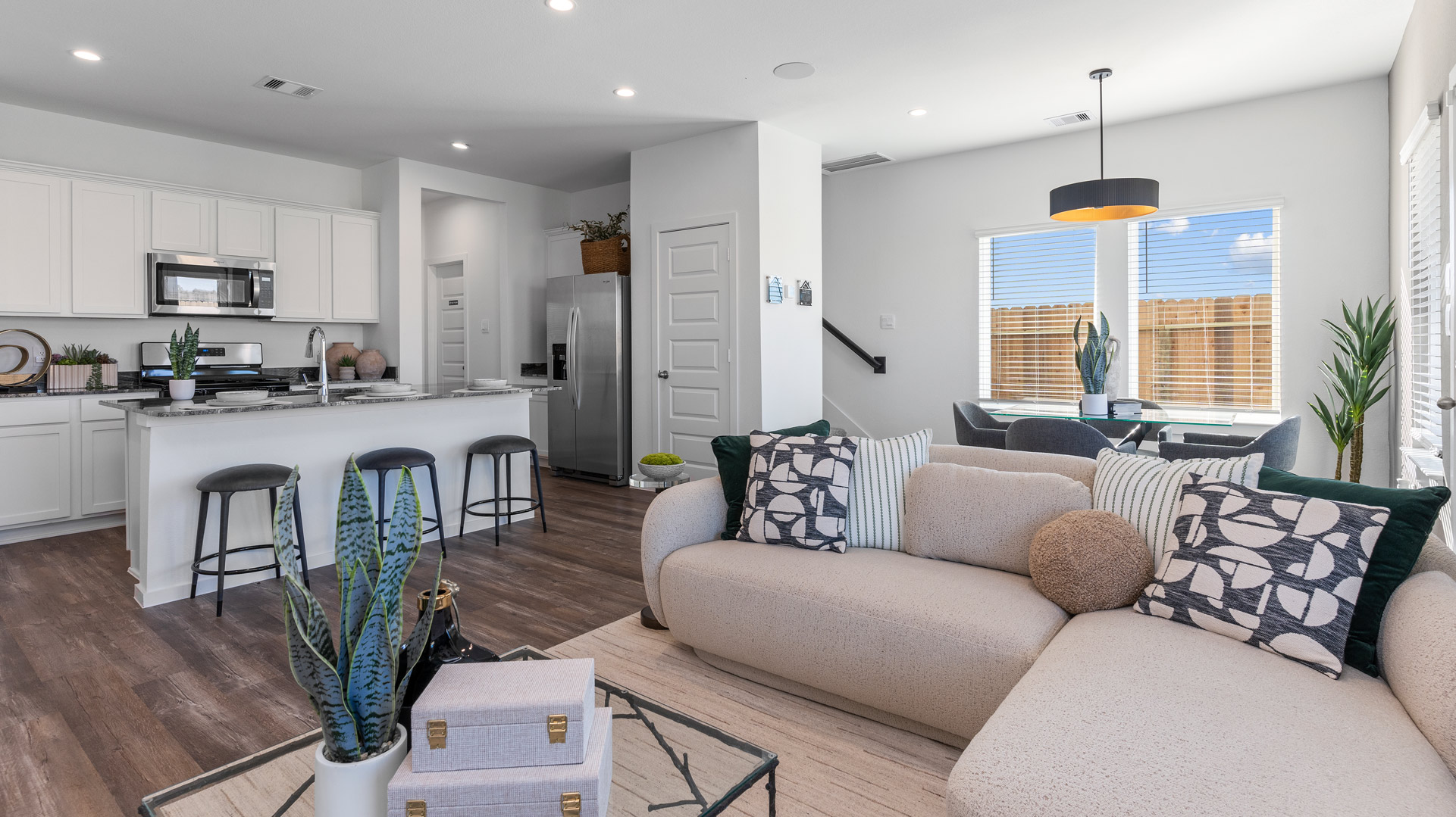 living room is open to the kitchen and dining areas