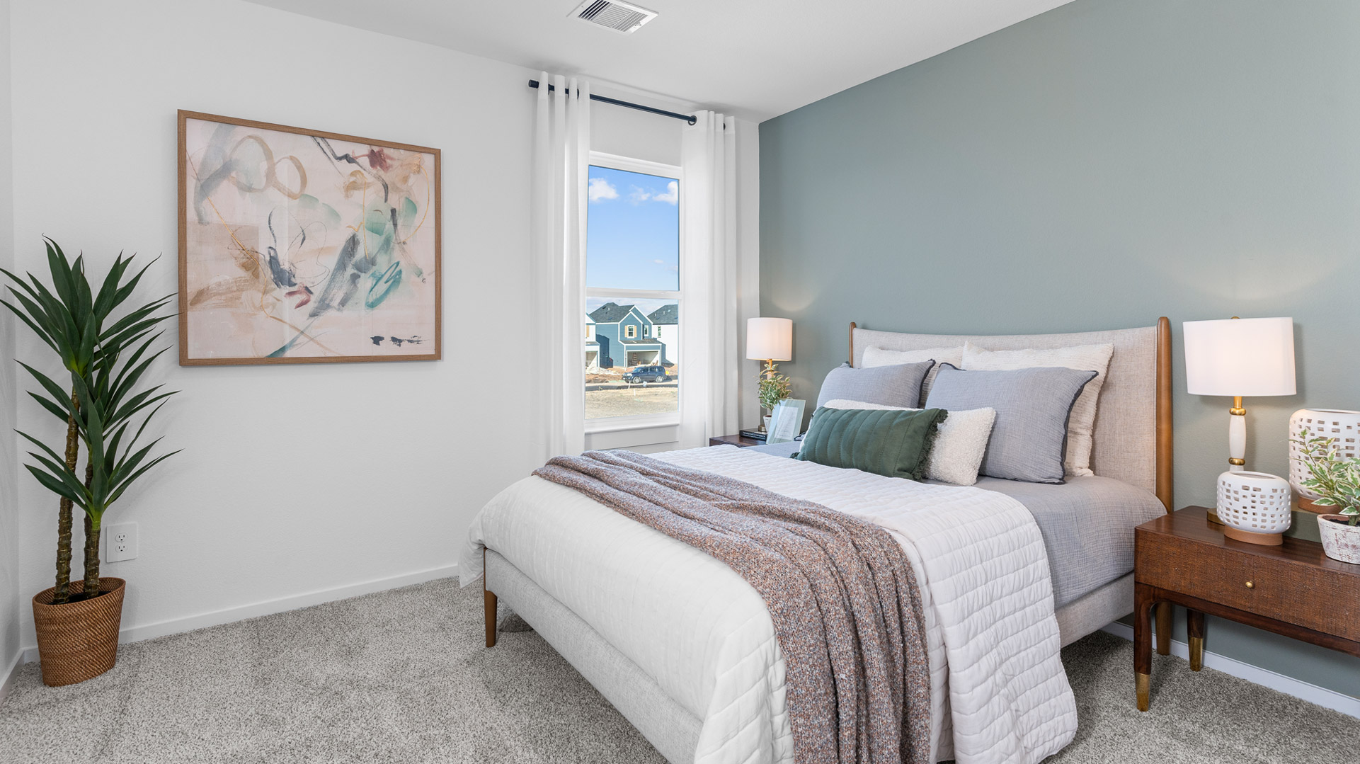 a second bedroom has a large single window for natural light