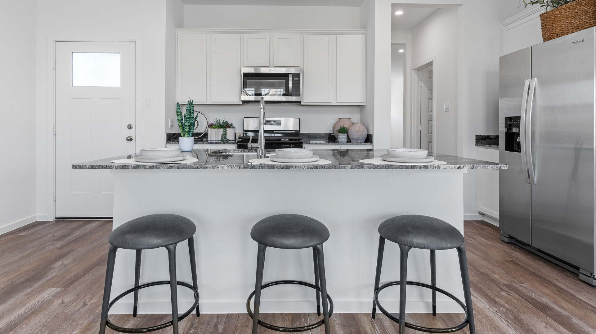 a spacious island offers the perfect spot for dining and entertaining