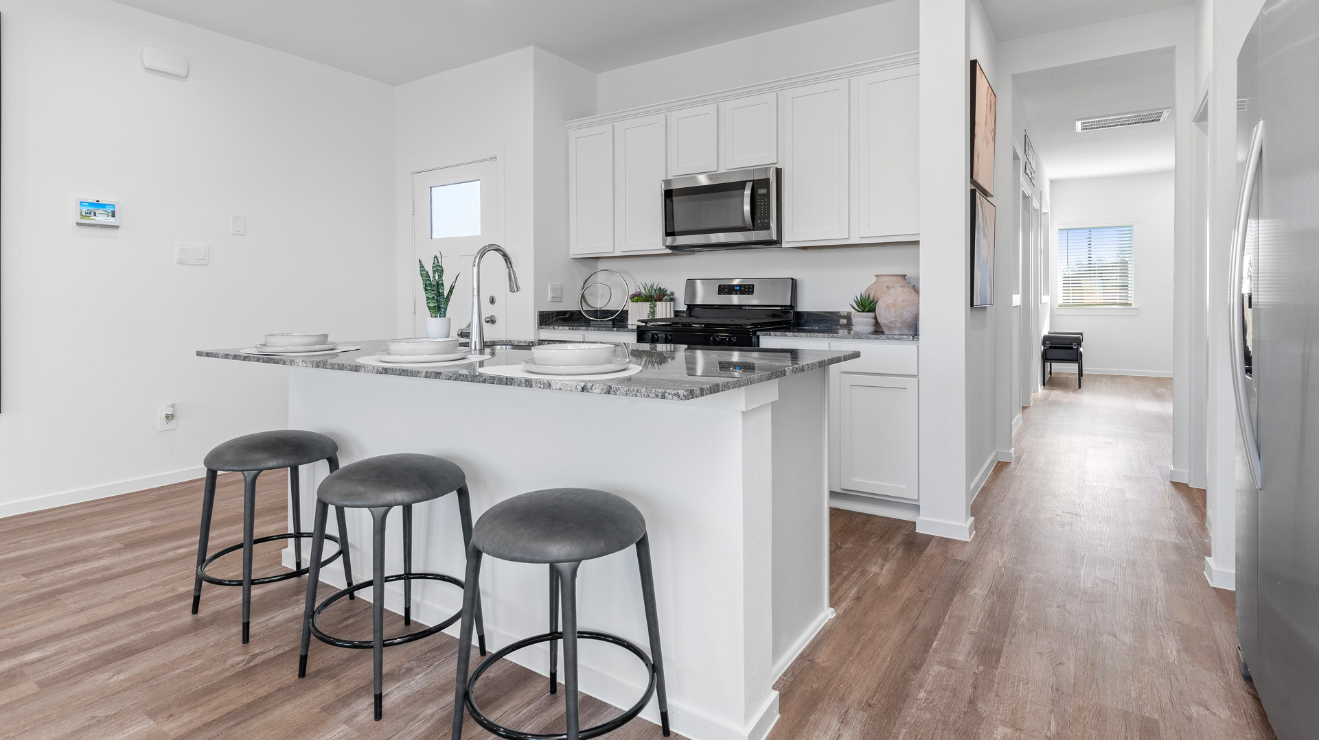 aspen plan kitchen located near the front of the home, just off the garage entry
