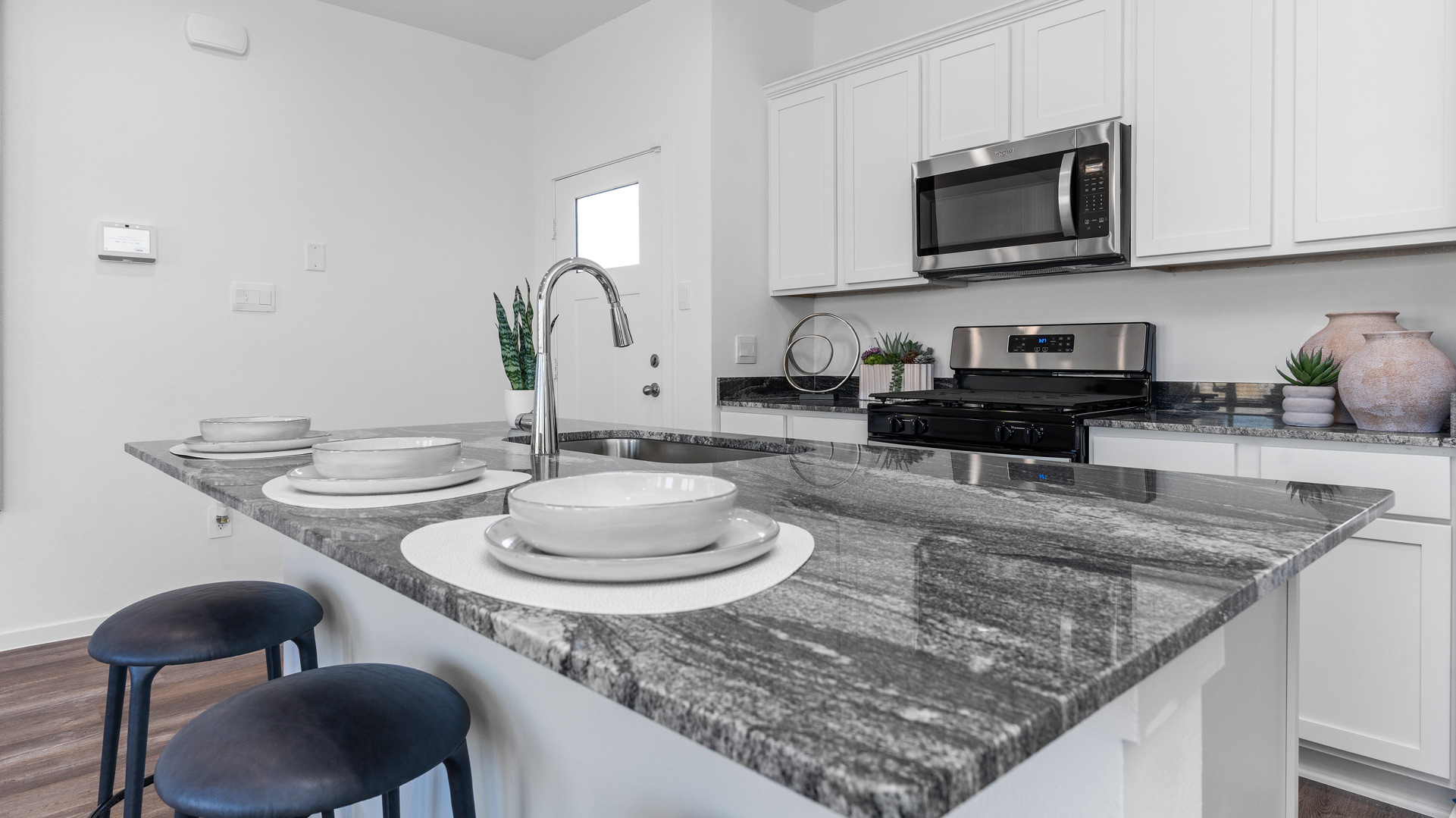 kitchen with white cabinets and granite countertops
