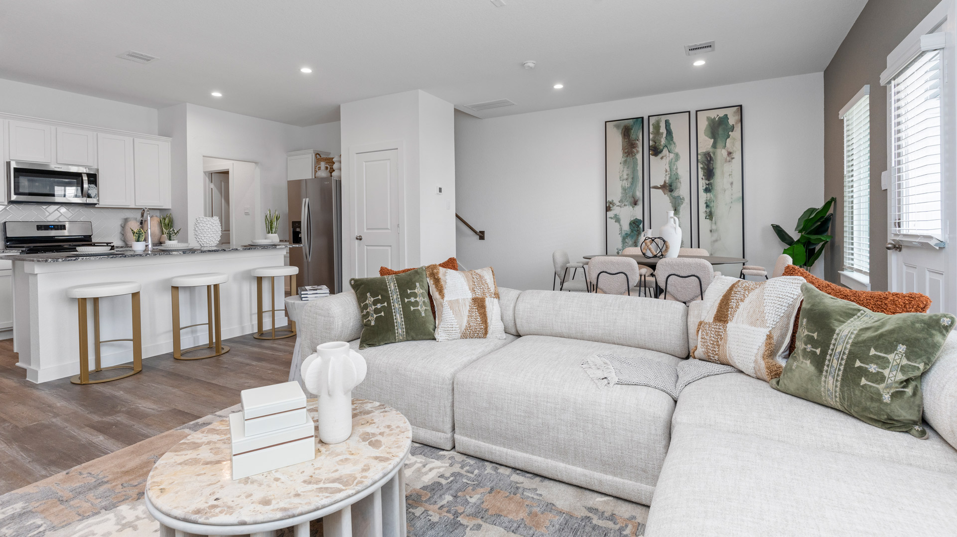 living room opens to kitchen and dining area