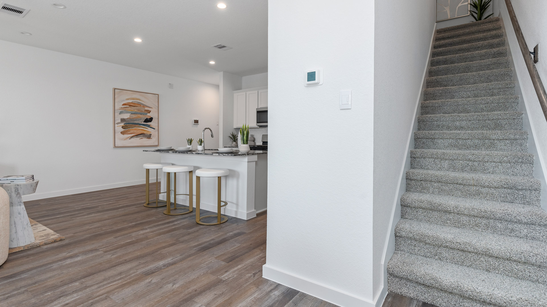 carpet stairs lead you up to all bedrooms