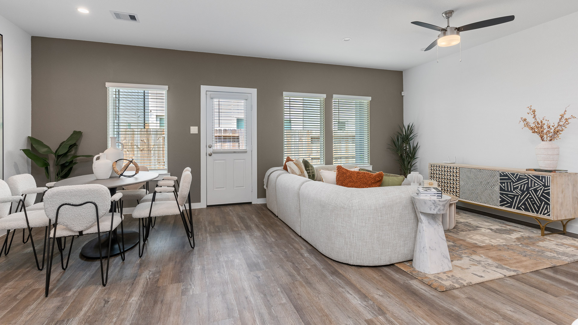 living room and dining area open to eachother in the rear of the home