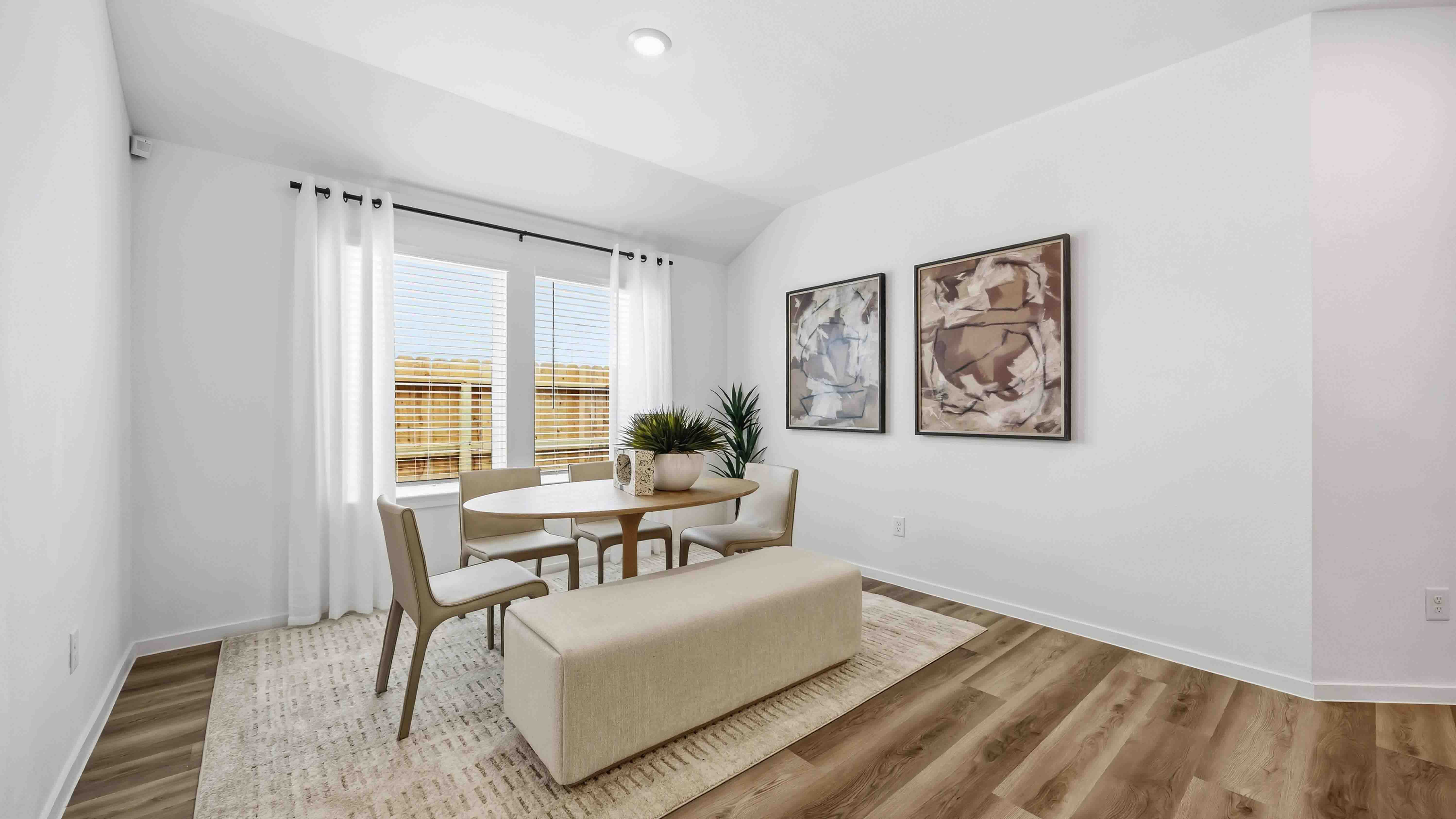 spacious dining area with vinyl wood flooring, large window and tall ceiling