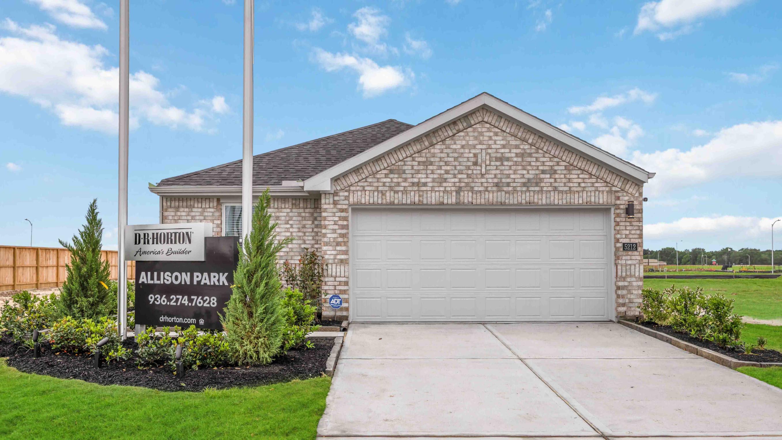 Newly built single story Farmhouse home with modern architecture, a double garage, and landscaped front yard