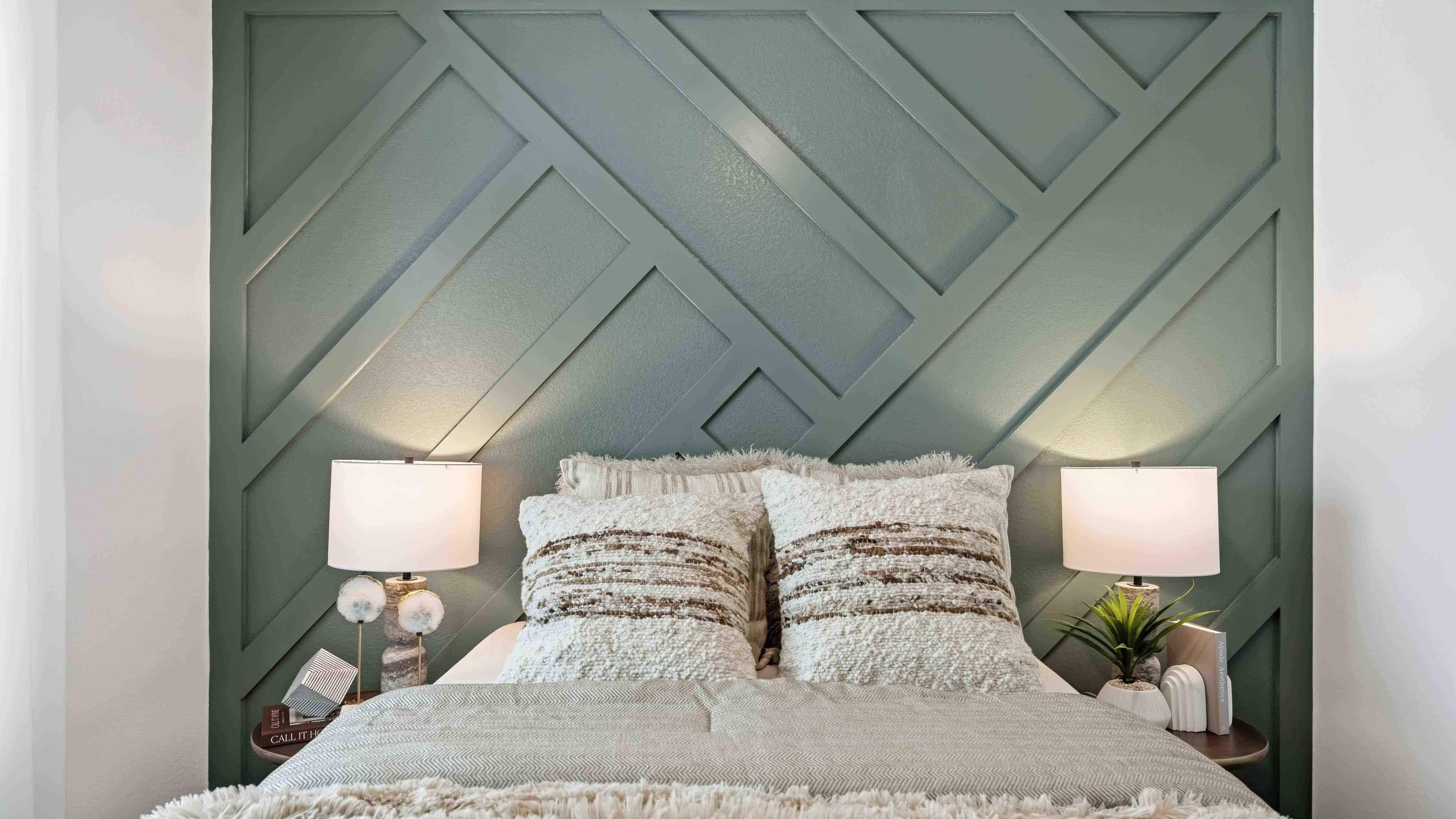 comfortable guest bedroom featuring neutral-toned walls, carpeted flooring, and a separate closet