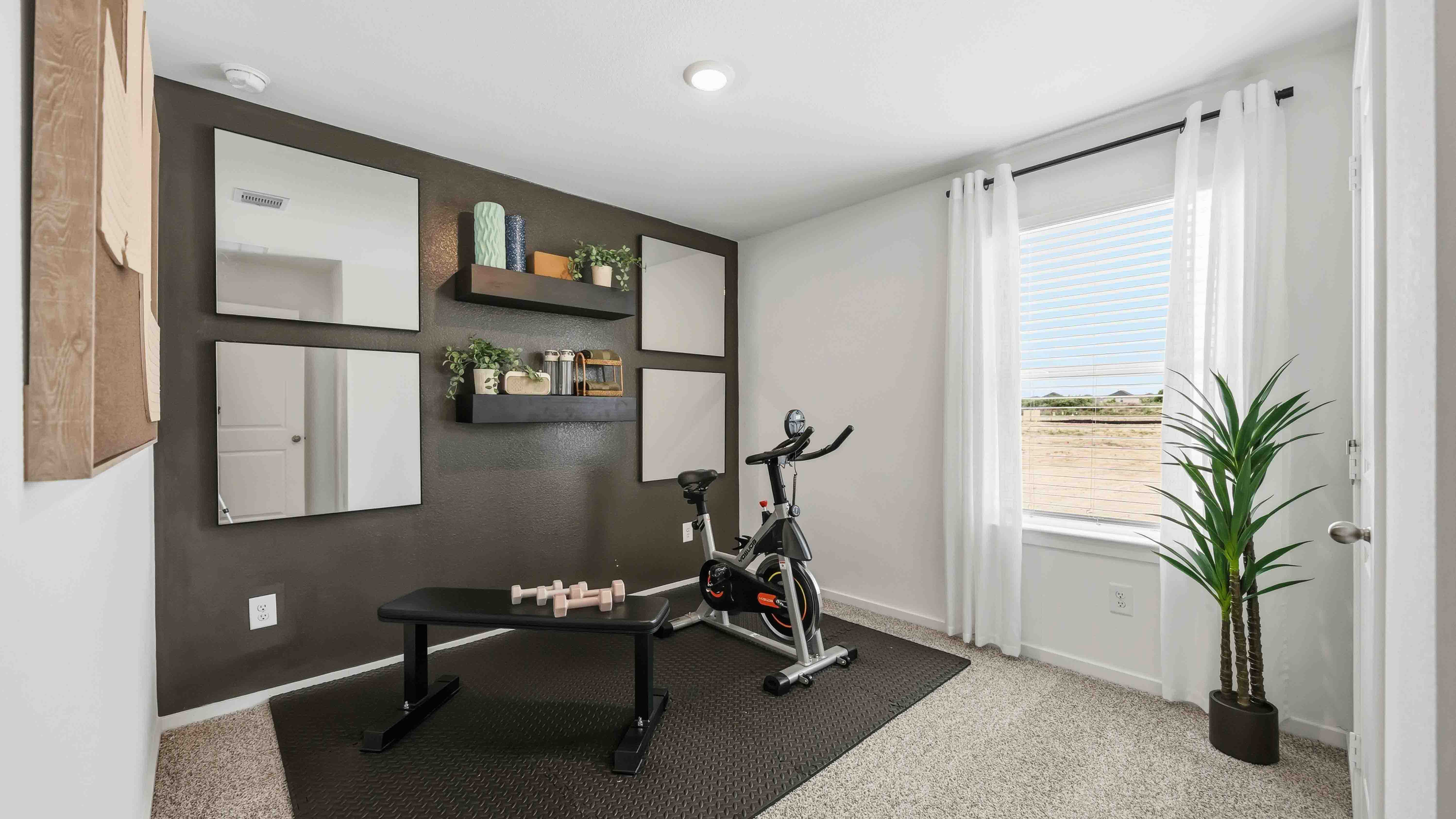 home office/third bedroom has light neutral walls and carpet flooring
