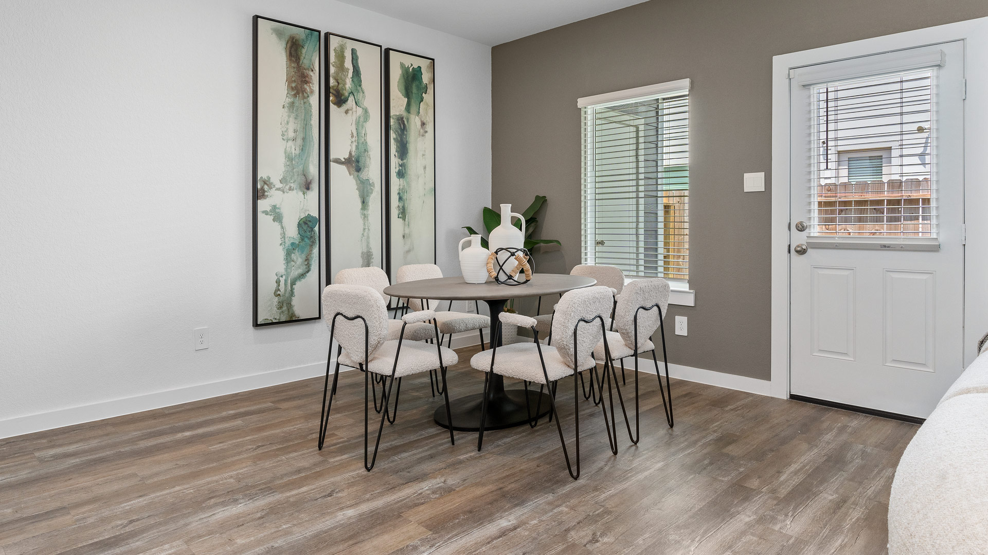 dining area with natural lighting that overlooks the backyard
