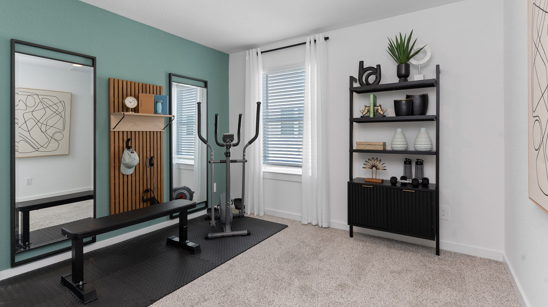 a third bedroom, shown as a home gym, is also located upstairs