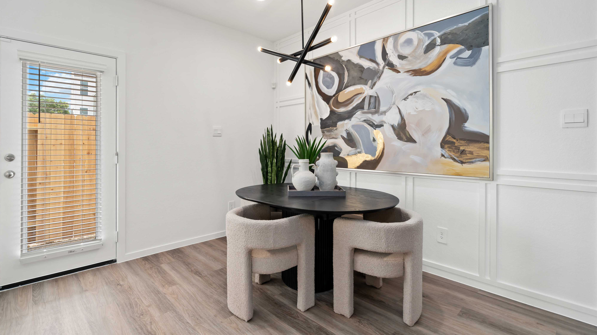dining area with natural lighting that overlooks the backyard