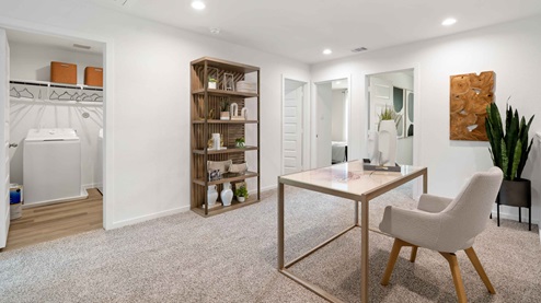 alaia crossing model home upstairs loft shown as a home office space