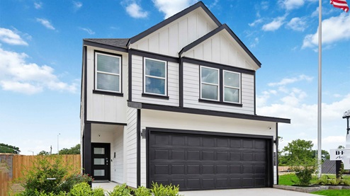 alaia crossing model home exterior elevation, a two story home with a two car garage
