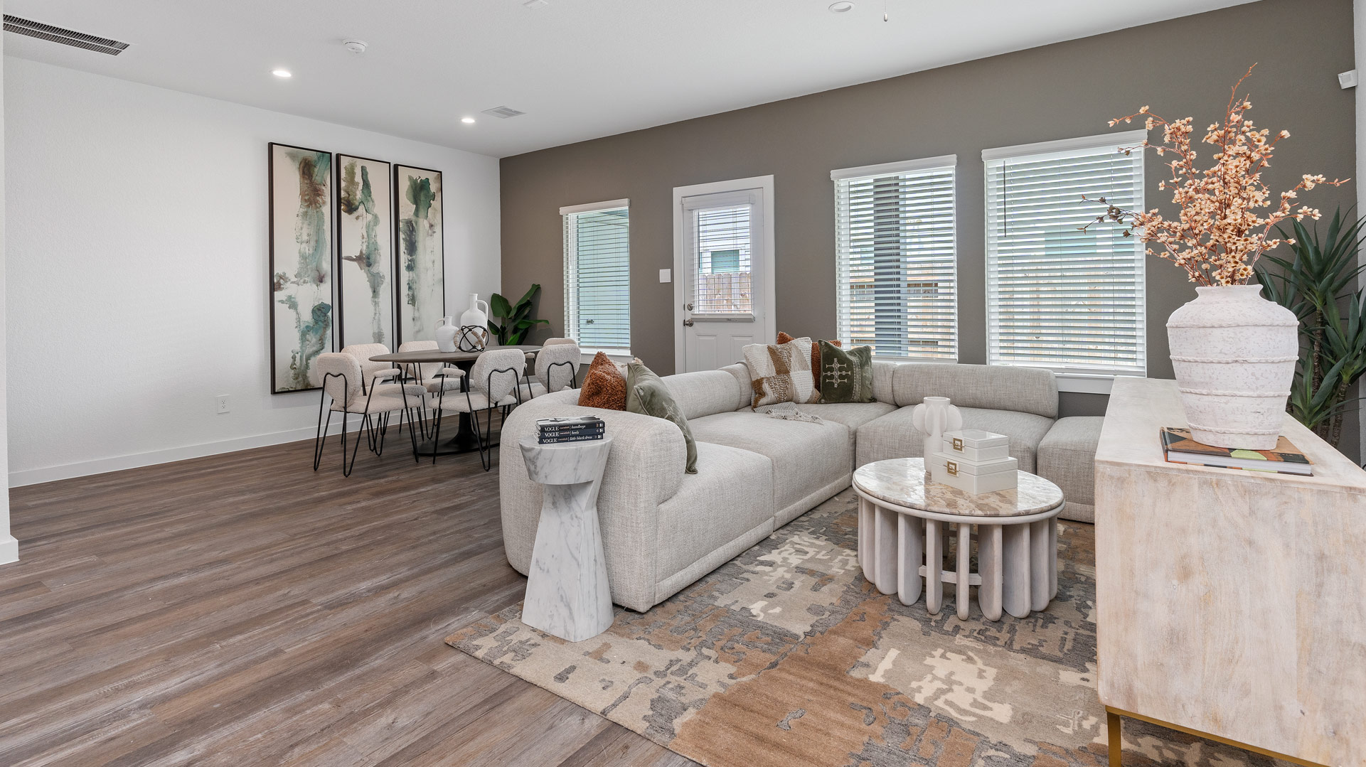 kitchen and dining room with several windows for natural light overlooking the backyard