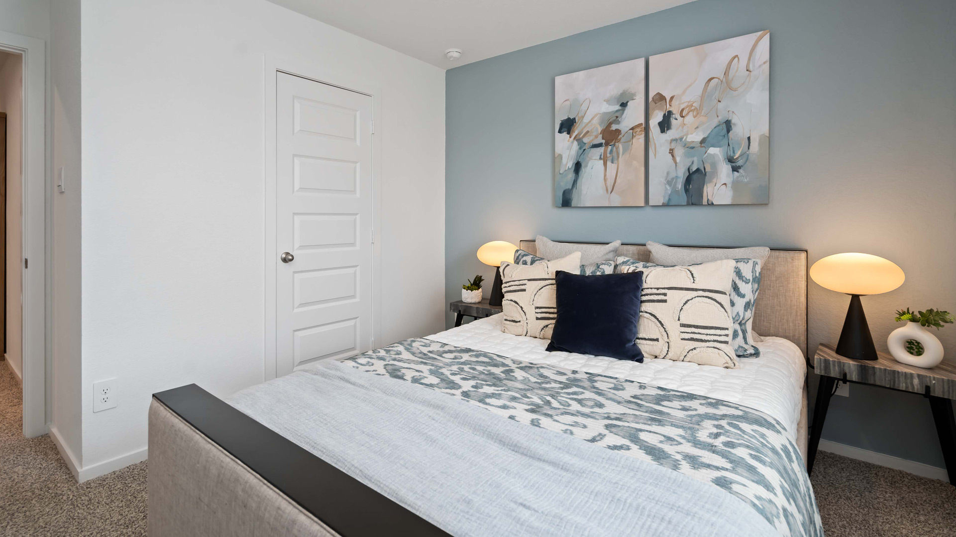 second bedroom has carpet flooring and light neutral walls