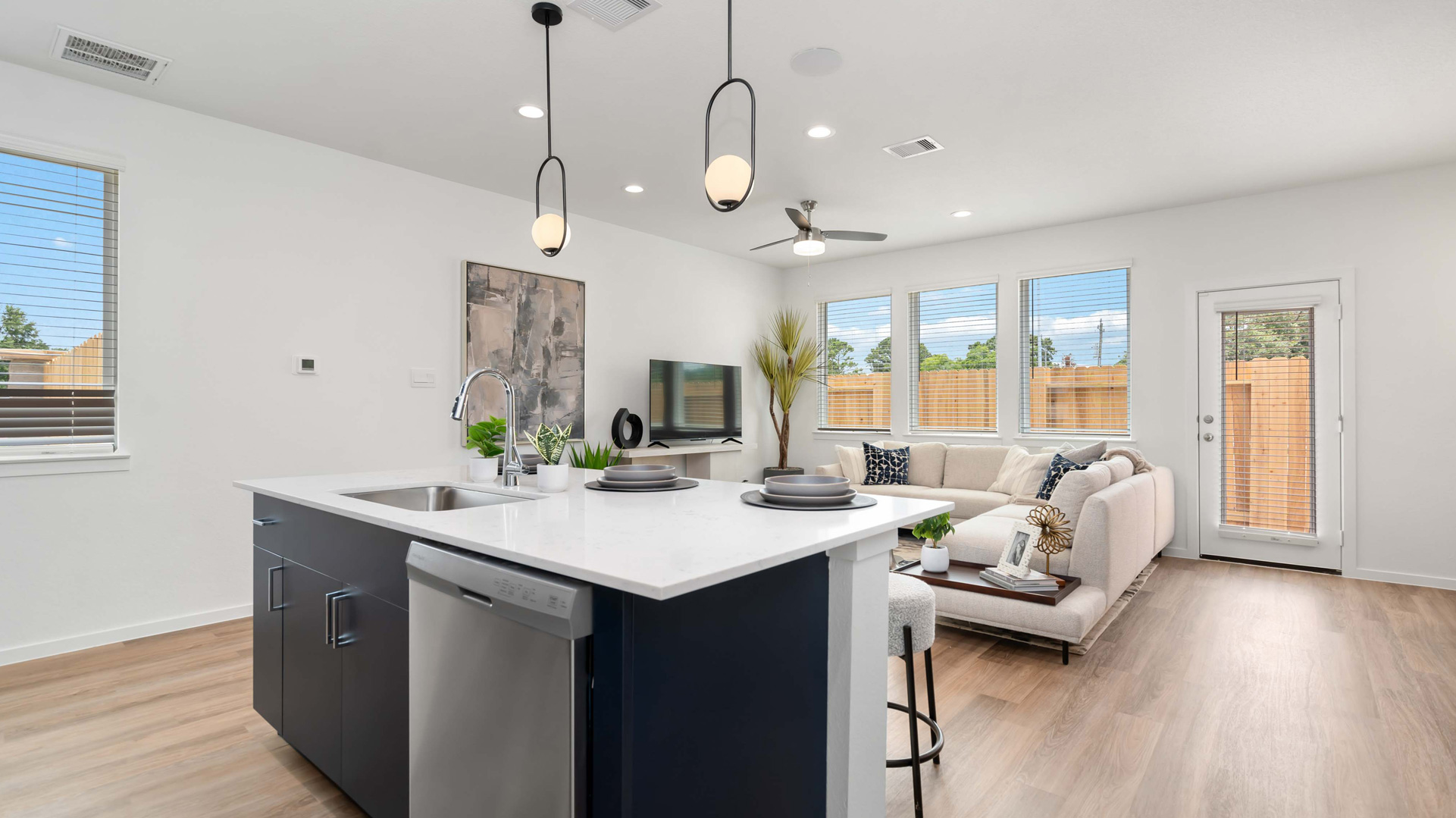 kitchen island overlooks the main living areas of the home